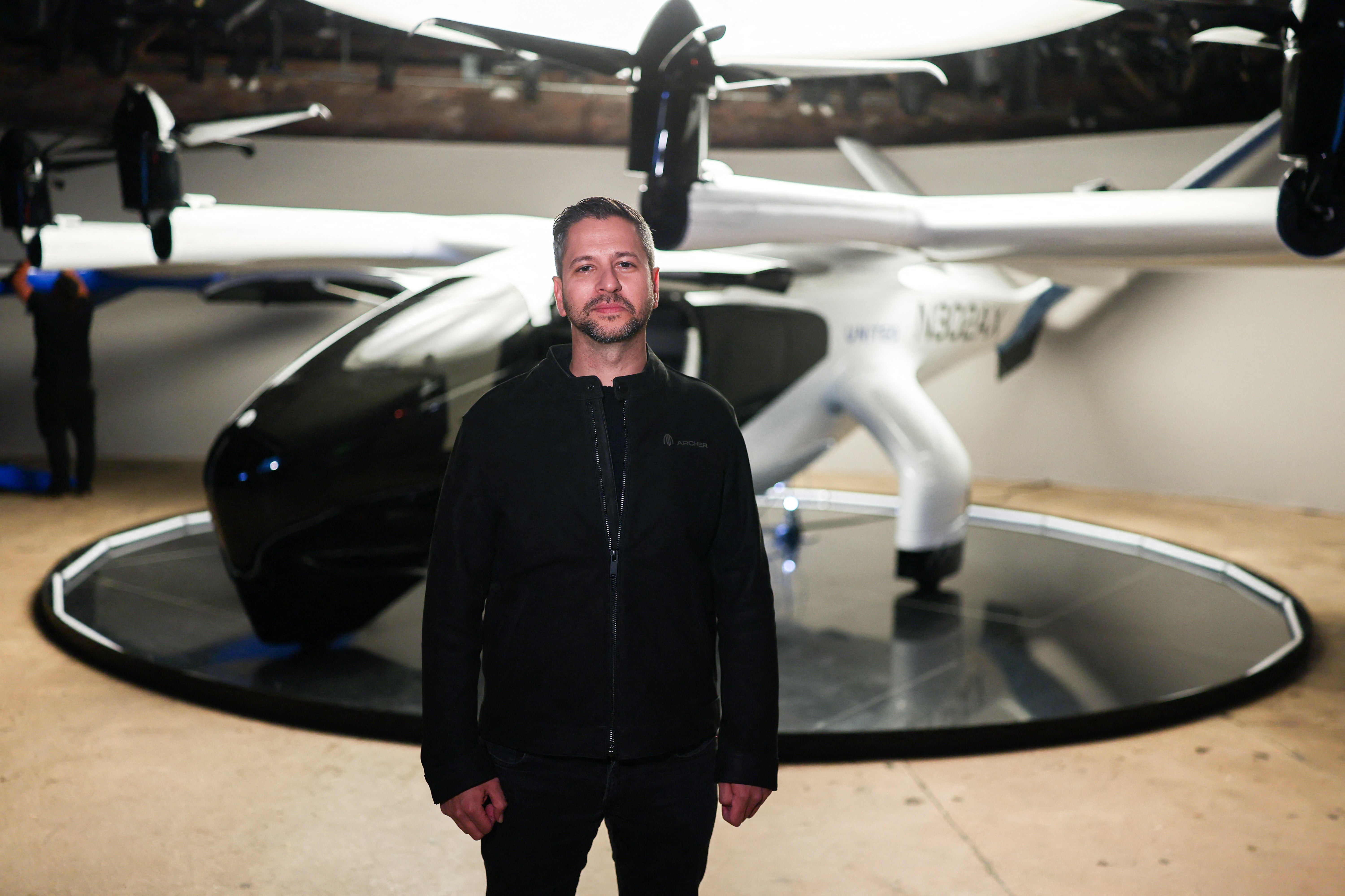 Archer Aviation CEO Adam Goldstein poses with the midnight eVTOL aircraft. The air-taxi firm will be used during the LA 2028 Olympics