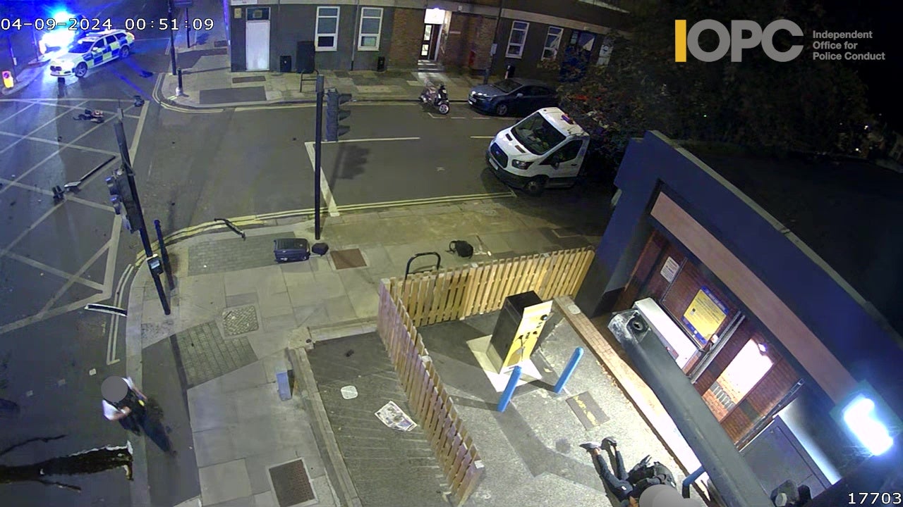 CCTV footage of the arrest shows Mr Richards being handcuffed by officers, and debris from the collision on the road