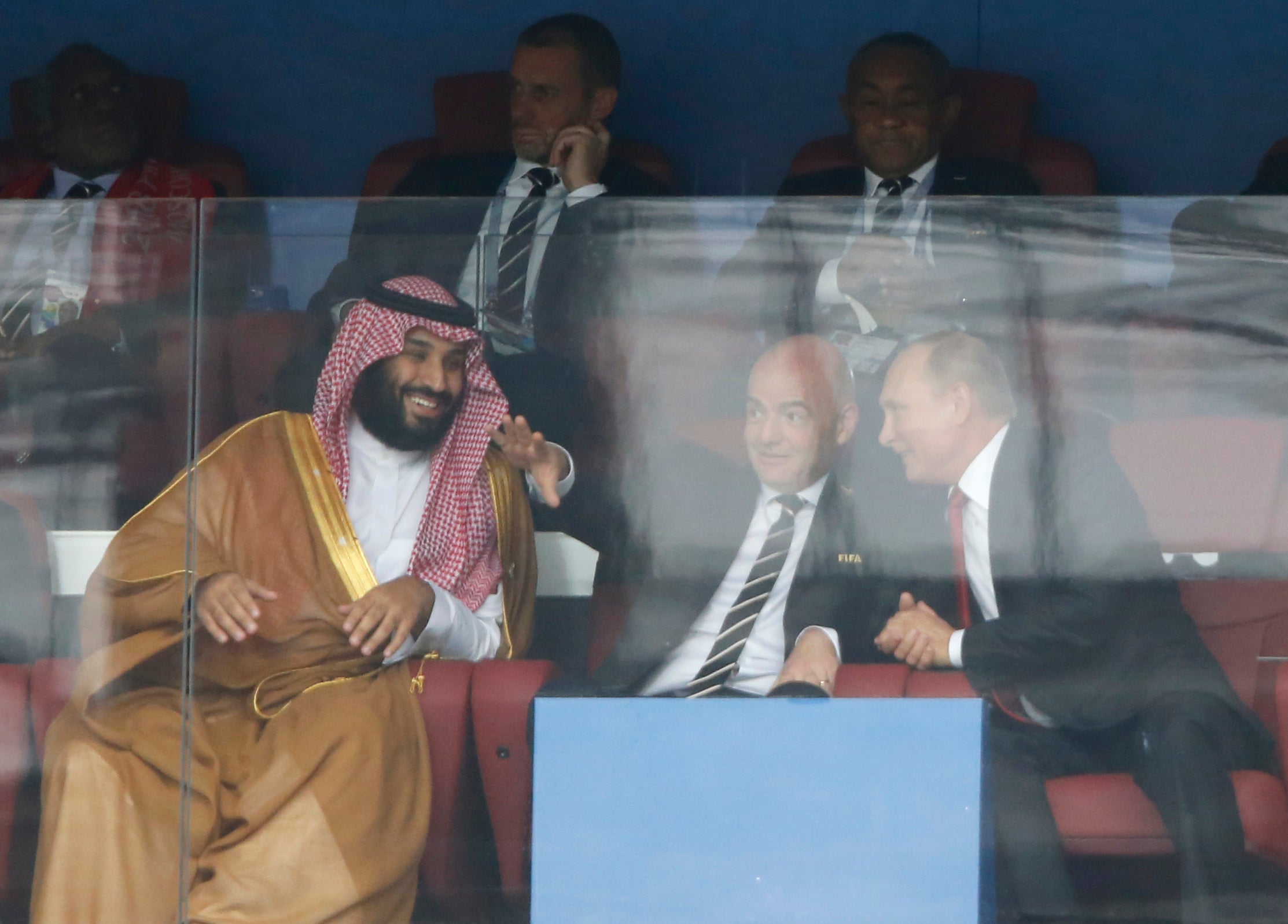Saudi Arabia Crown Prince Mohammed bin Salman, left, FIFA President Gianni Infantino, center, and Russian President Vladimir Putin watch the match between Russia and Saudi Arabia at 2018 World Cup