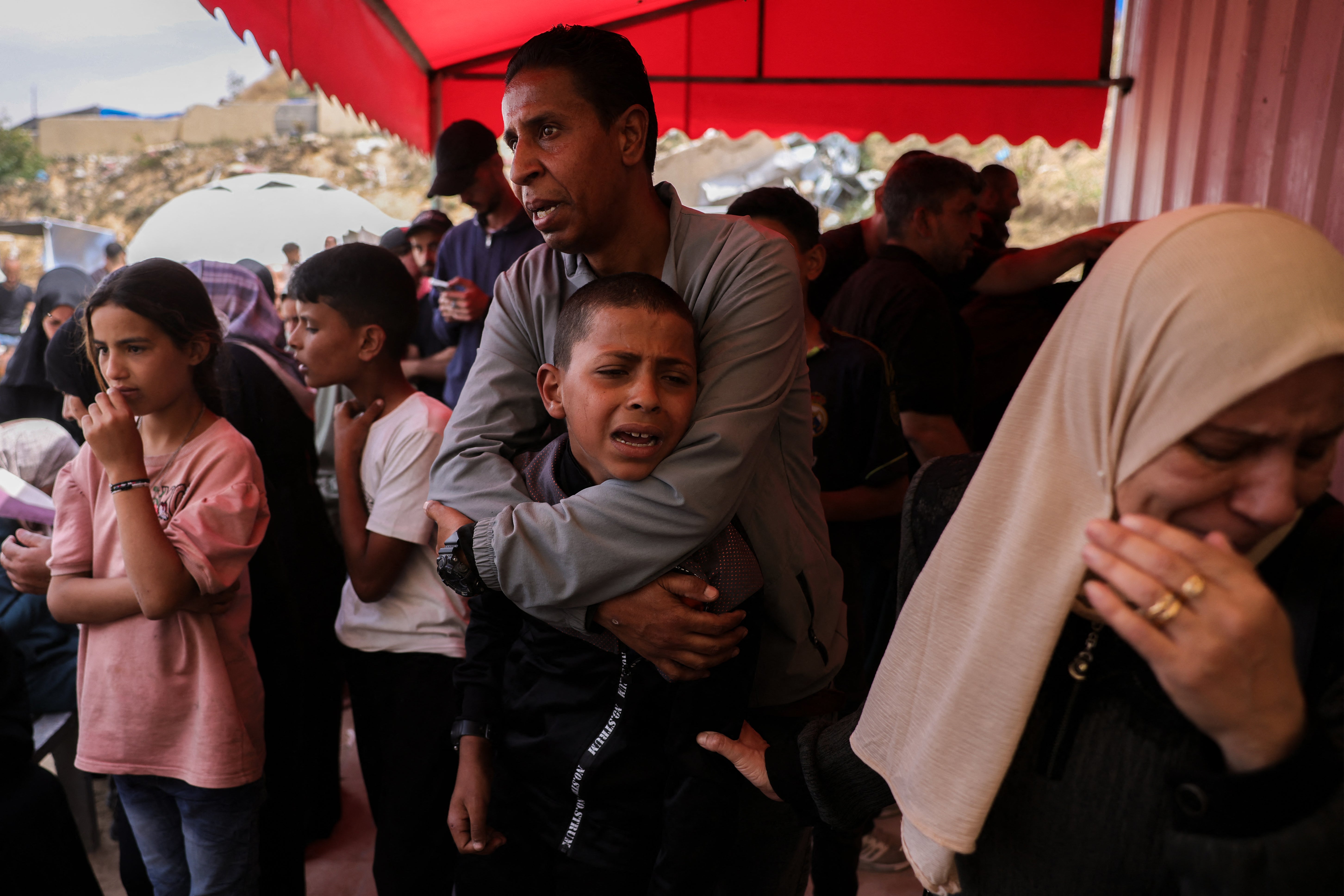A boy mourns victims of Thursday’s Israeli strikes on Gaza