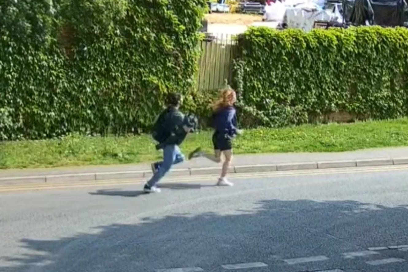 A screen grab taken from CCTV issued by the Metropolitan Police of two teenagers they want to speak to after two kittens were tortured and killed in Ruislip, London