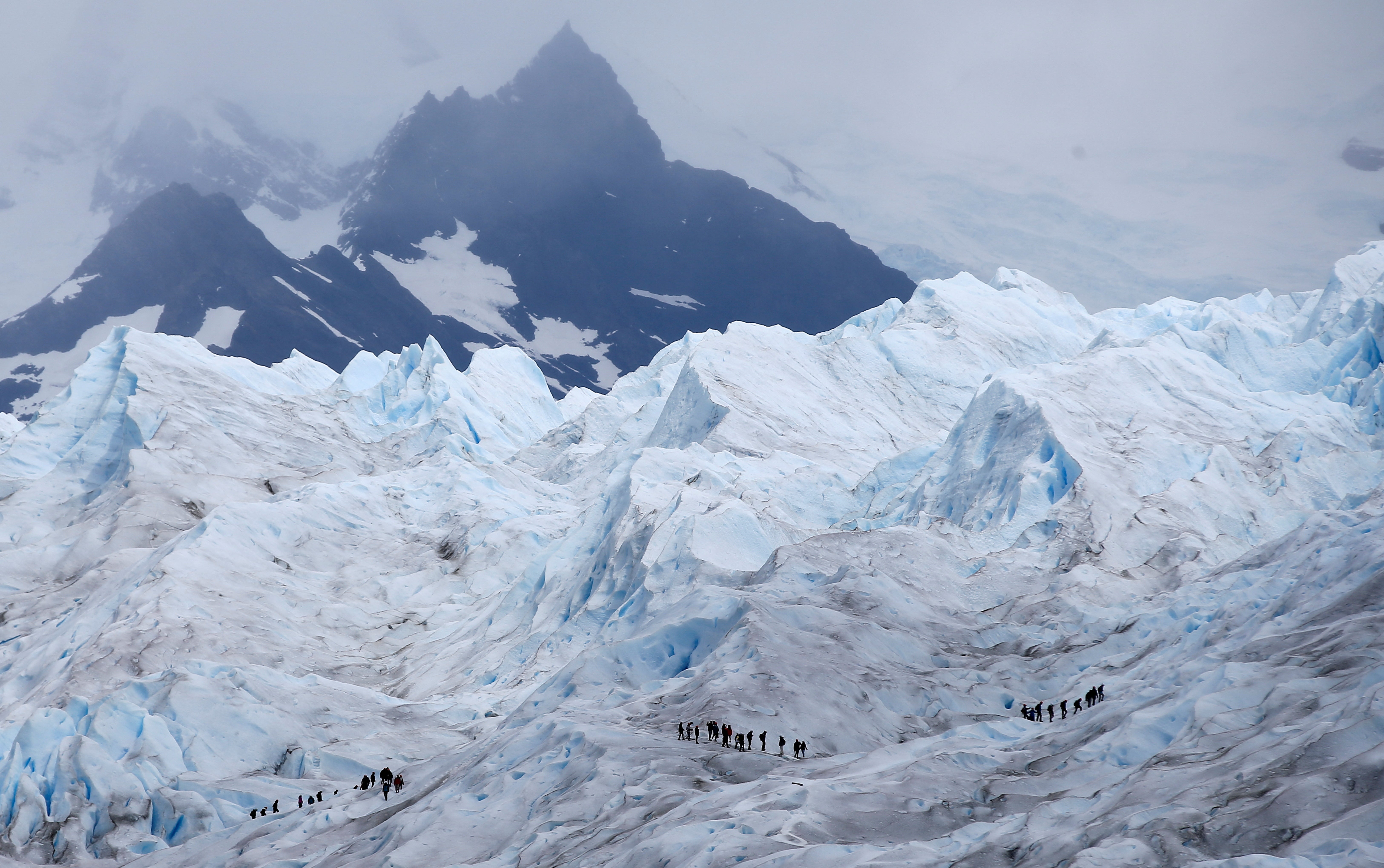Tourists trek on the Perito Moreno glacier