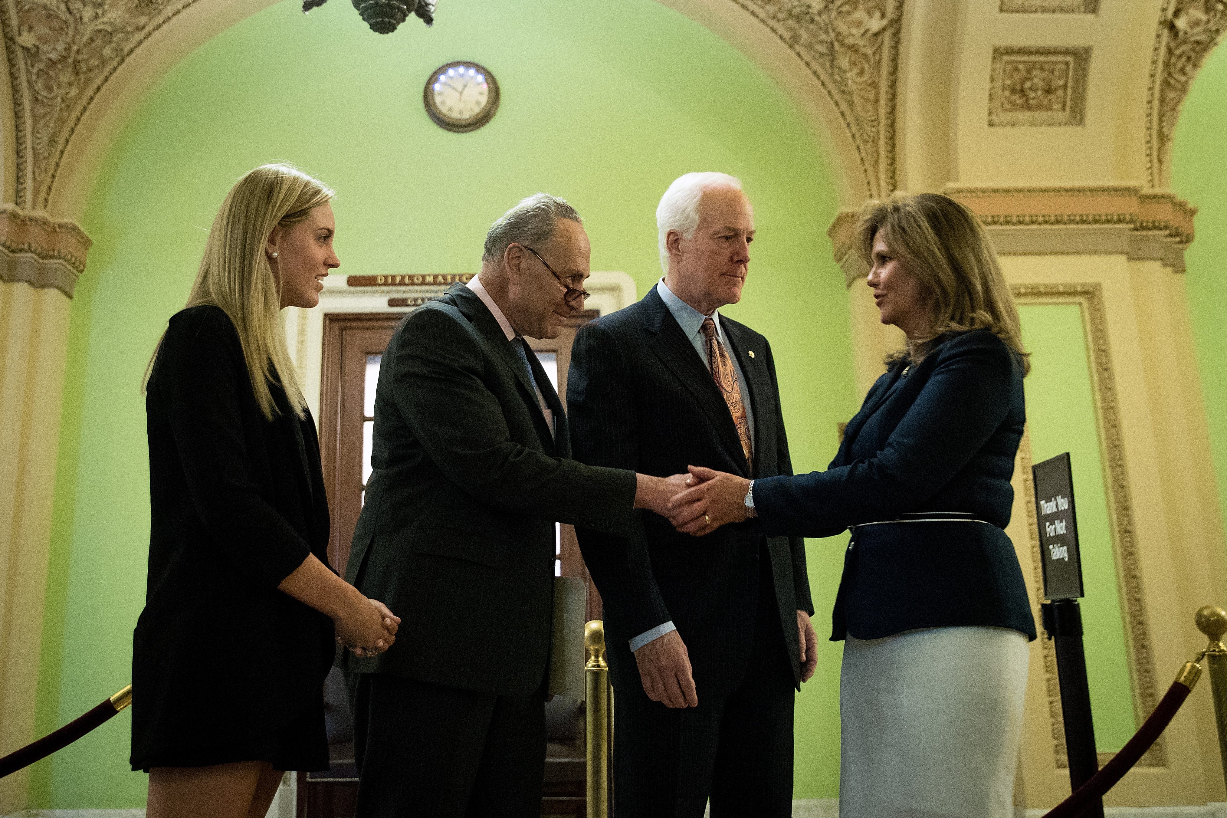 Strada (right) with Democratic Sen. Chuck Schumer (second from left), Republican Sen. John Cornyn (second from right), and Strada's daughter Kaitlyn (far left). She has spoken out about Trump’s relationship with the Saudi government.