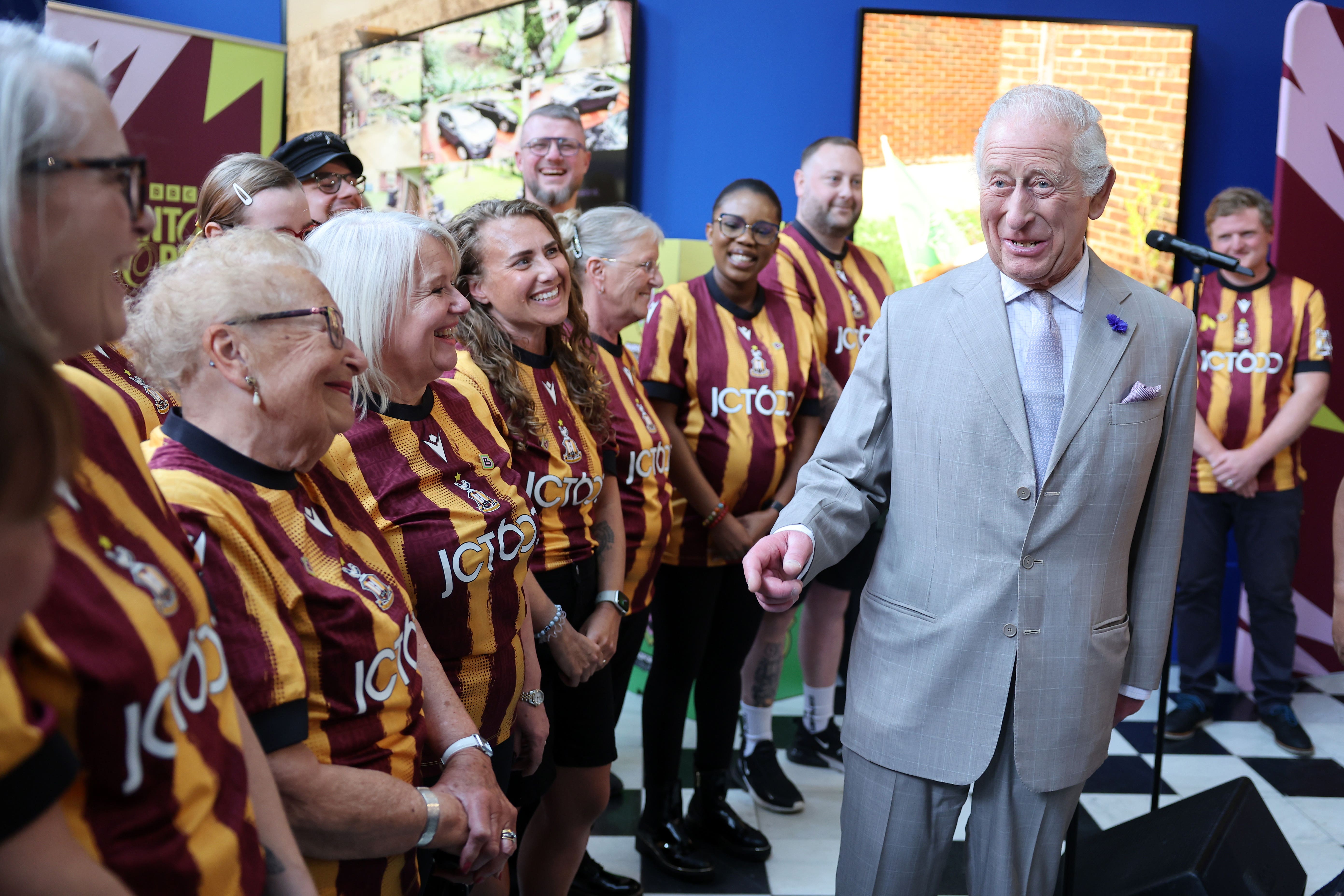 The King meets members of the Bantam of the Opera choir in Bradford (Chris Jackson/PA)