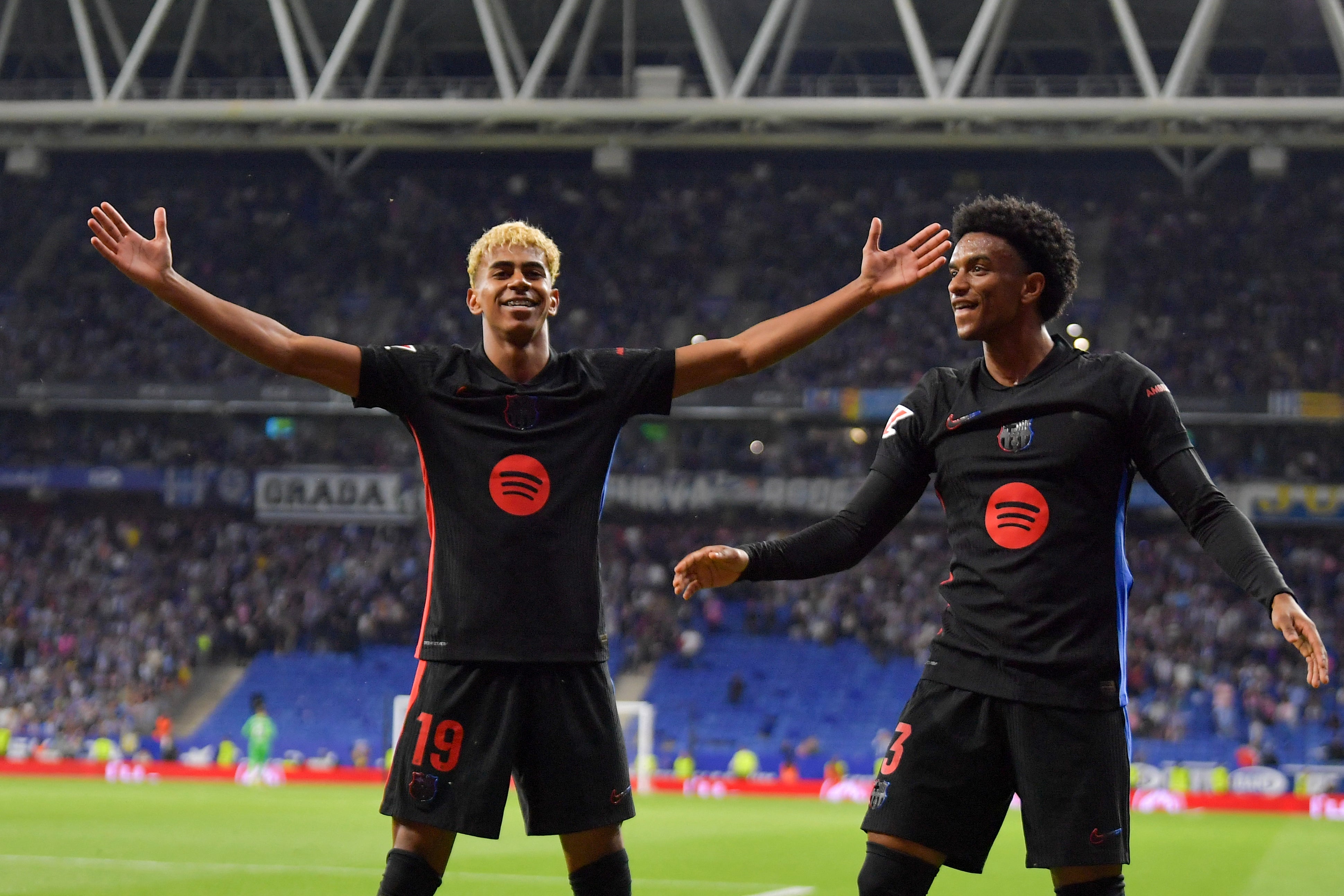 Lamine Yamal celebrates alongside Alex Balde after scoring Barcelona's first goal