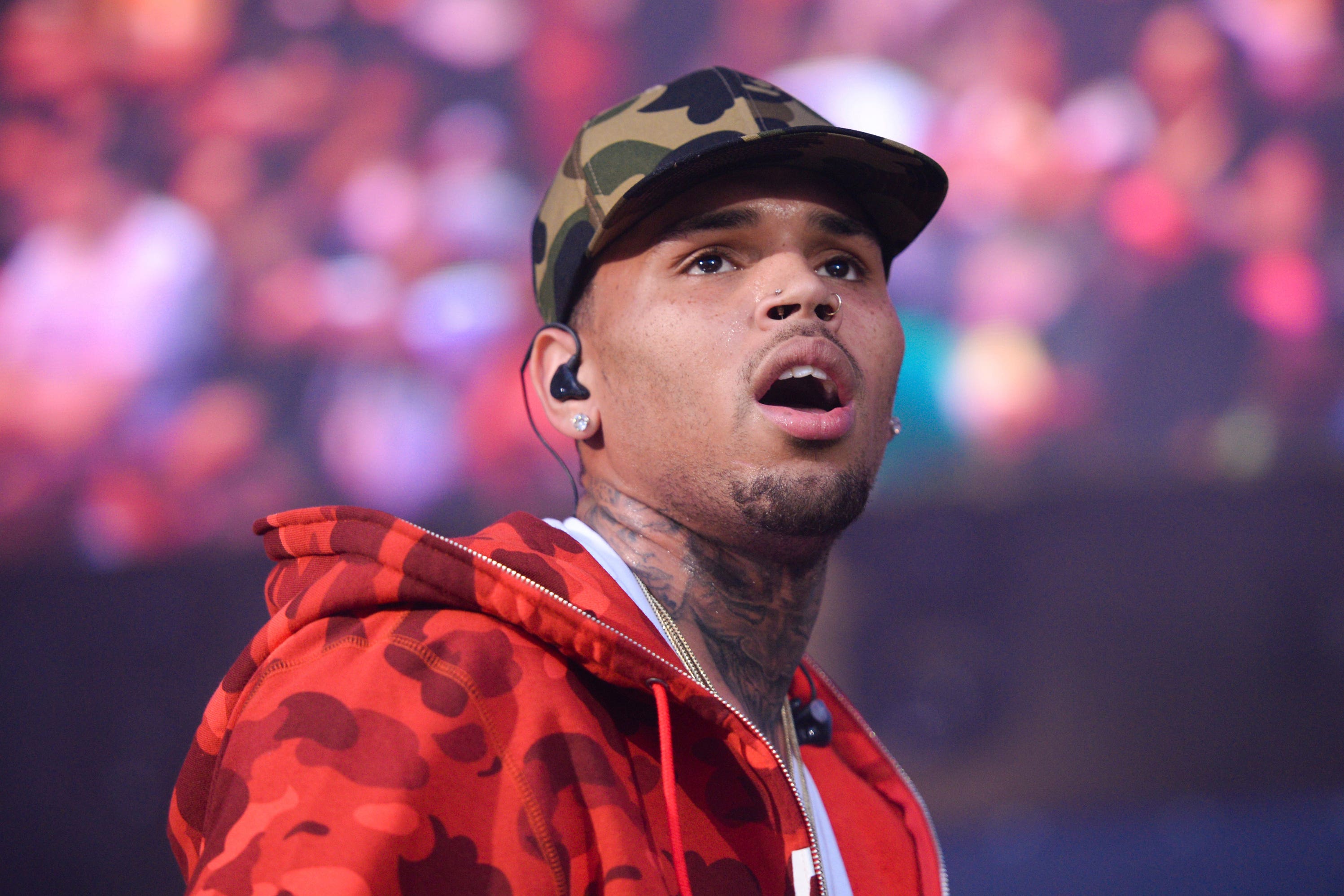 Chris Brown was charged by police with grievous bodily harm with intent over an alleged bottle attack at a London nightclub two years ago (Scott Roth/Invision/AP)