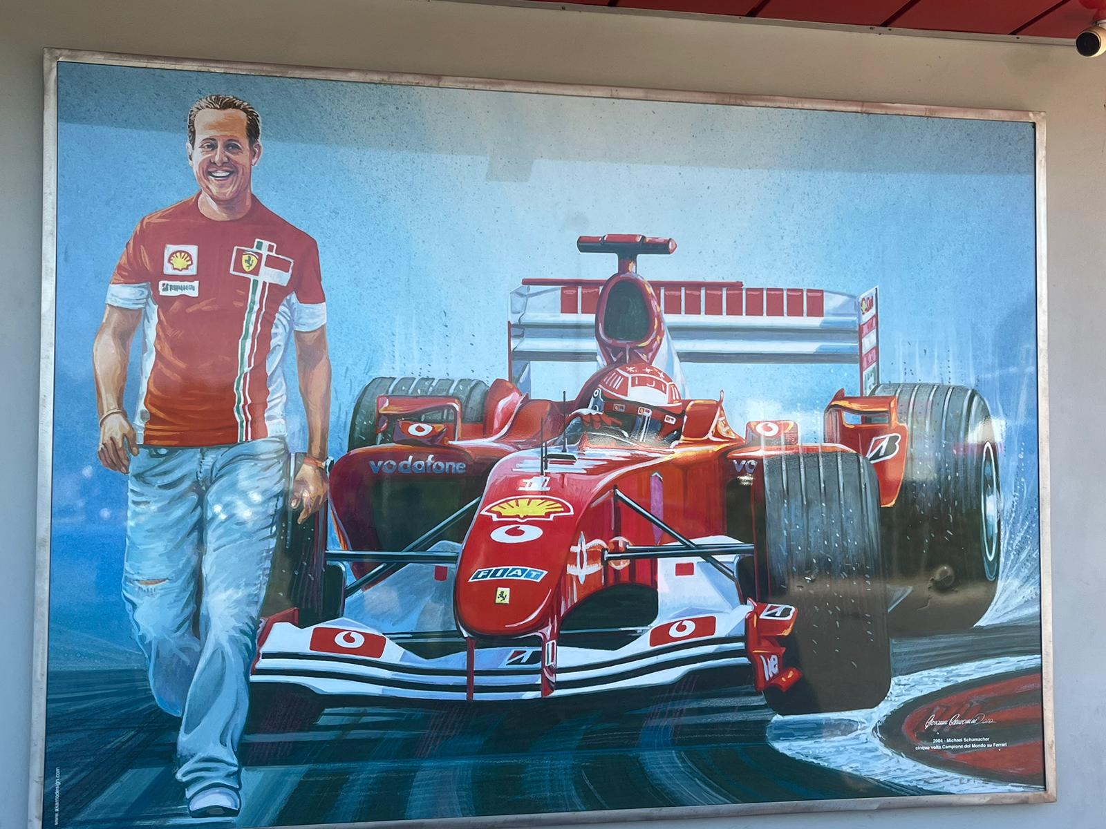 A painting of Michael Schumacher outside the Museo Ferrari Maranello