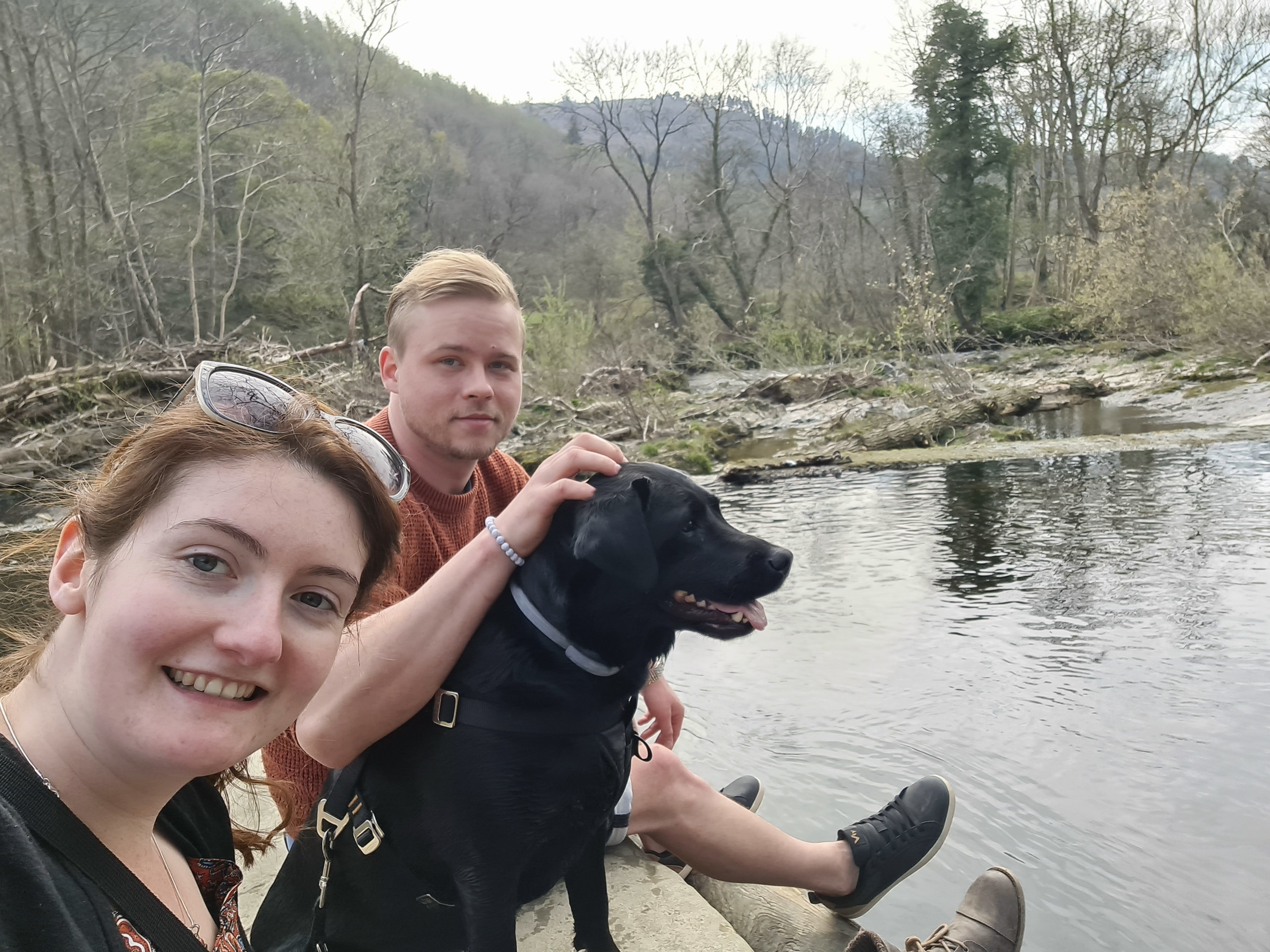 Ms Wallace with her partner Maciej Filipiak and dog Damson