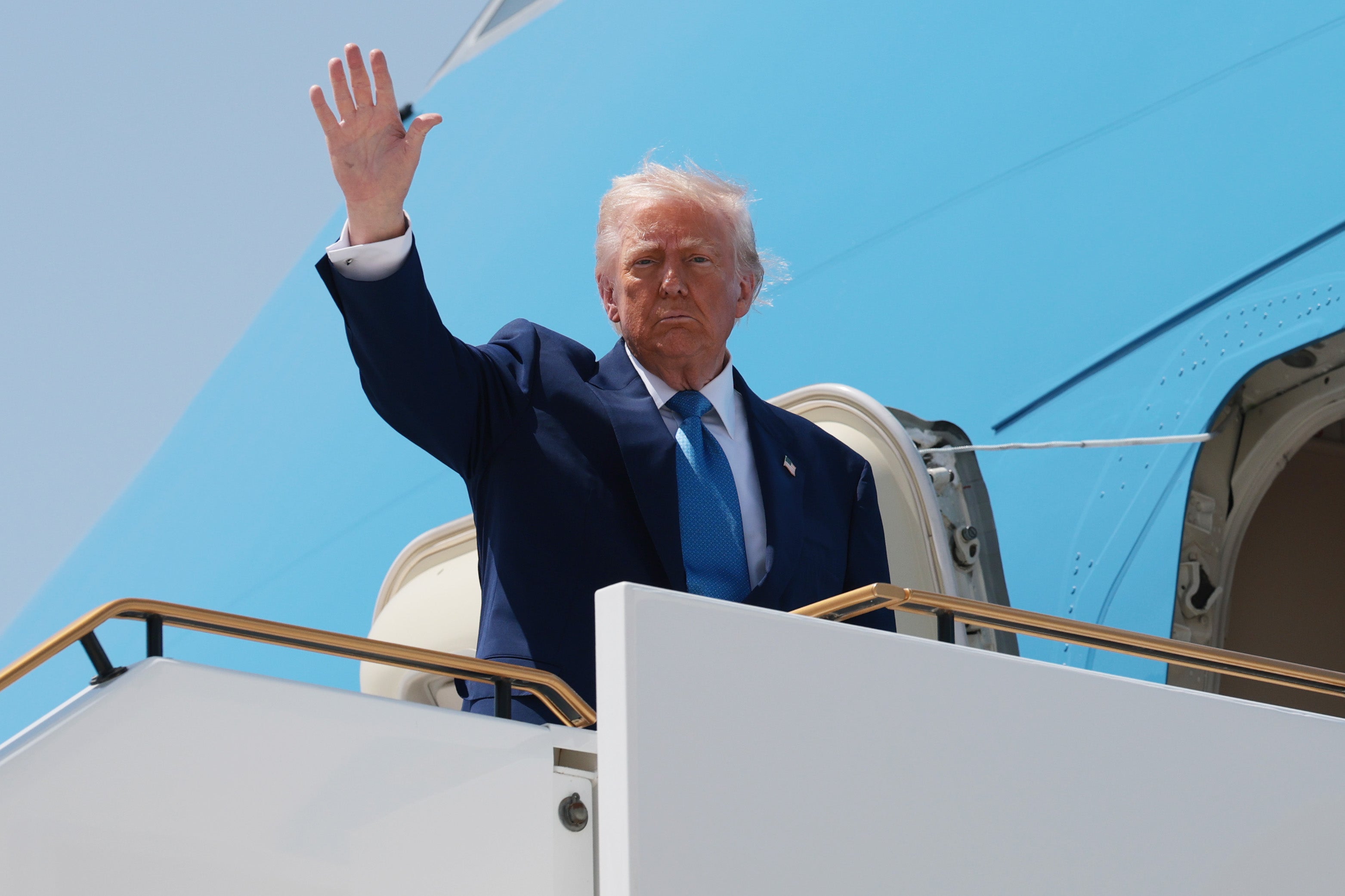 Donald Trump boards Air Force One in Abu Dhabi