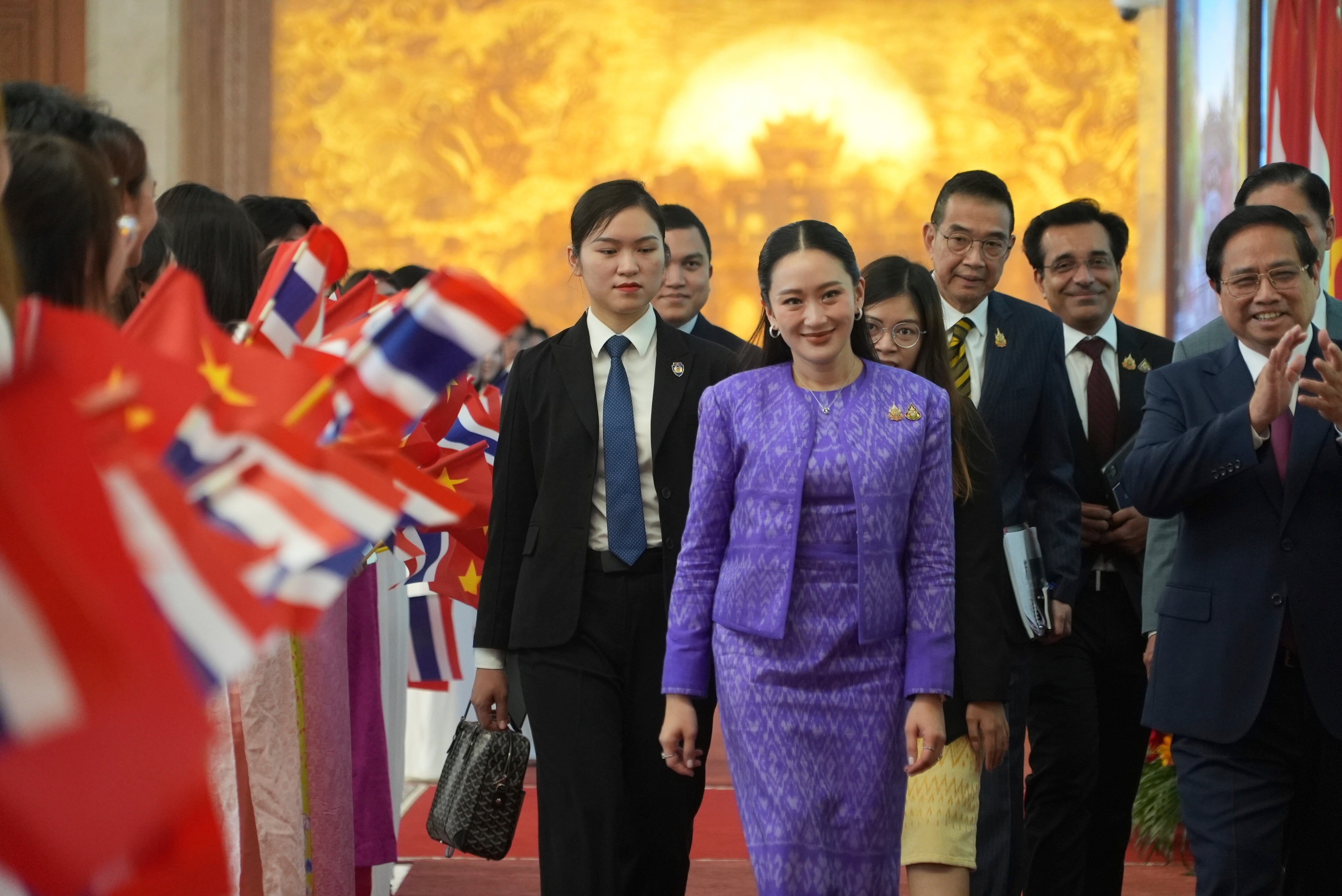 Thai Prime Minister Paetongtarn Shinawatra, front center, walks to a meeting in Hanoi, Vietnam Friday, May 16, 2025. (AP Photo/Hau Dinh)