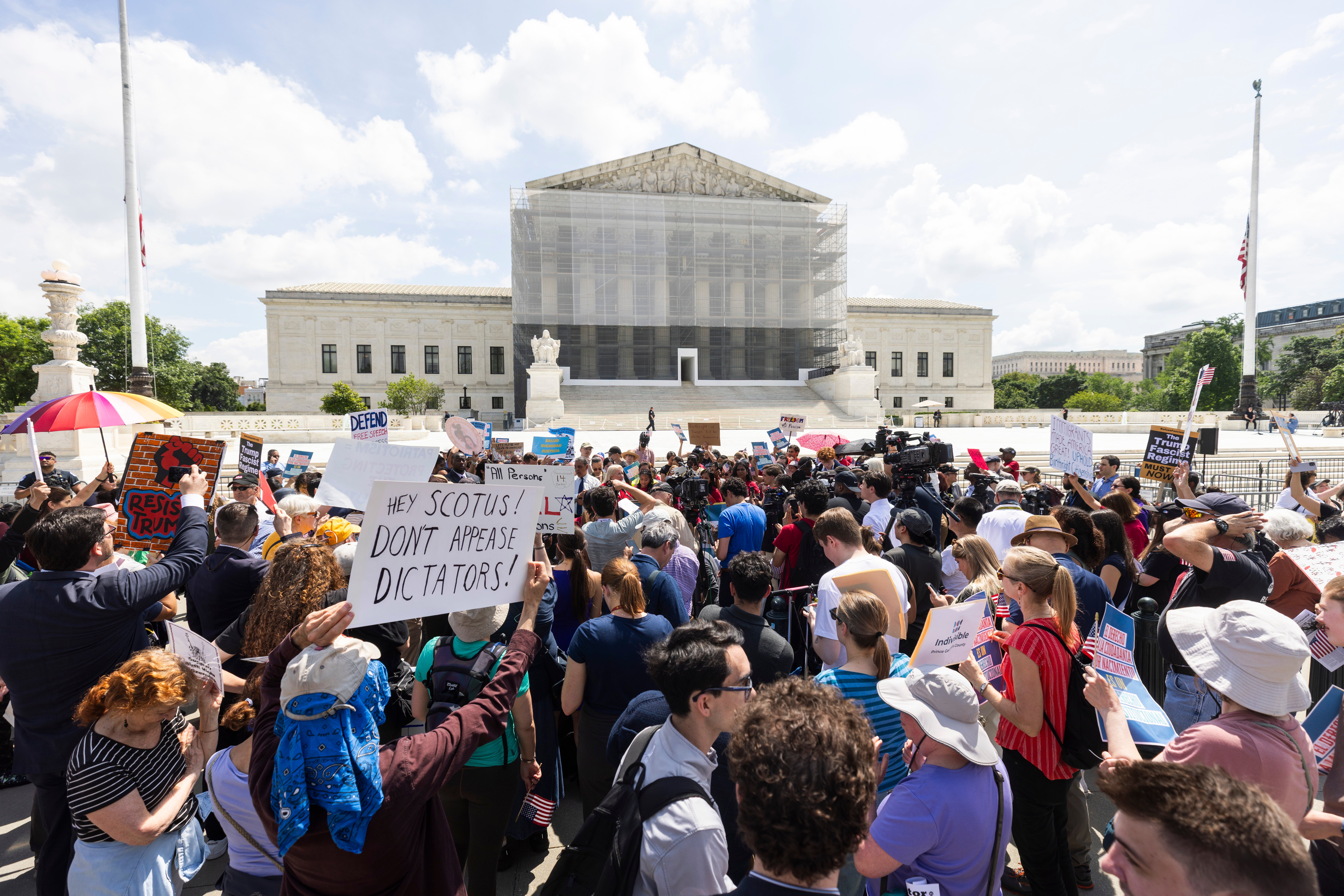 Protesters rally outside the Supreme Court on May 16 as the Trump administration defends his executive order restricting birthright citizenship