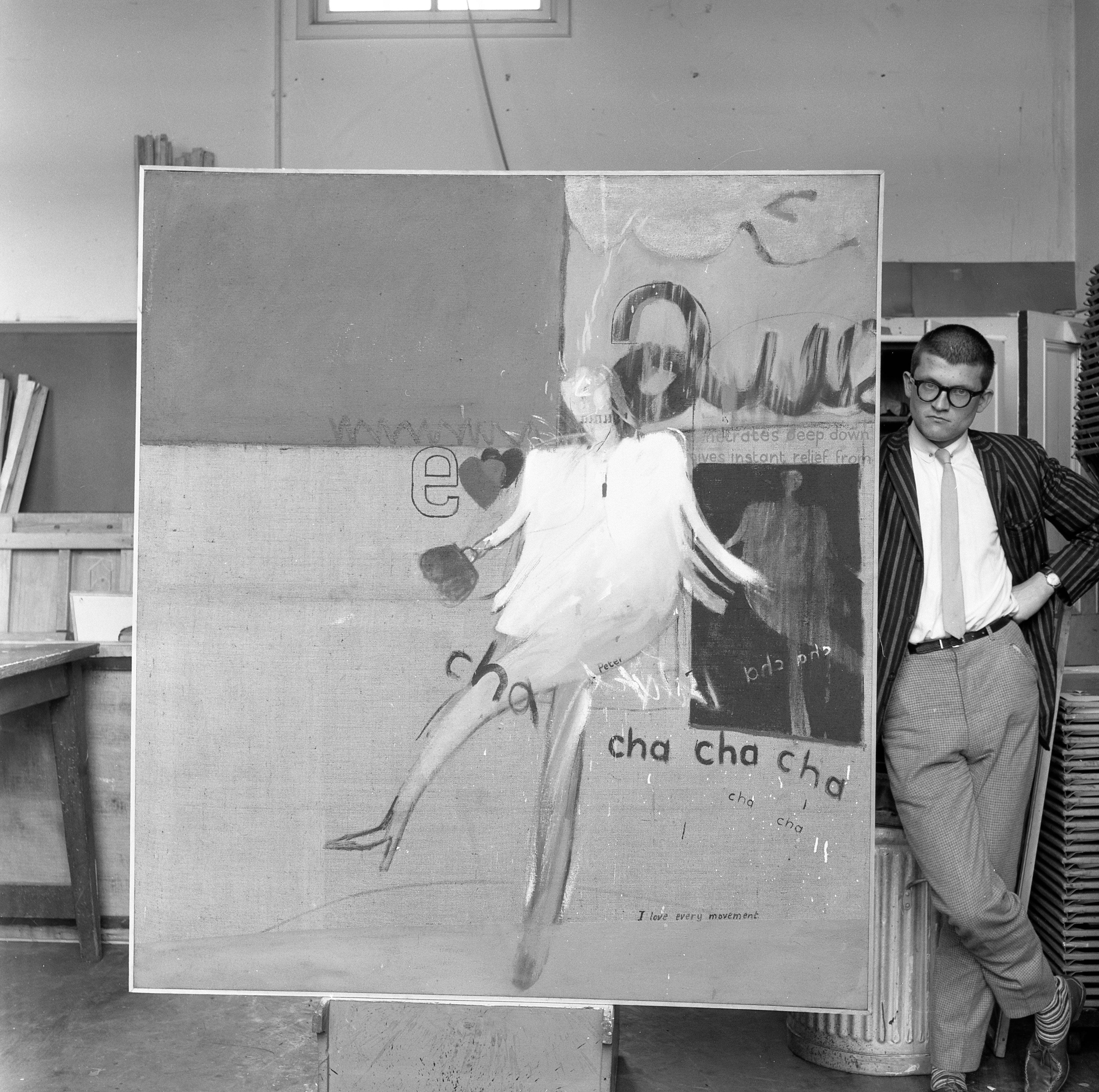 David Hockney pictured with his painting ‘Cha Cha Cha’ at the Royal College of Art in 1963