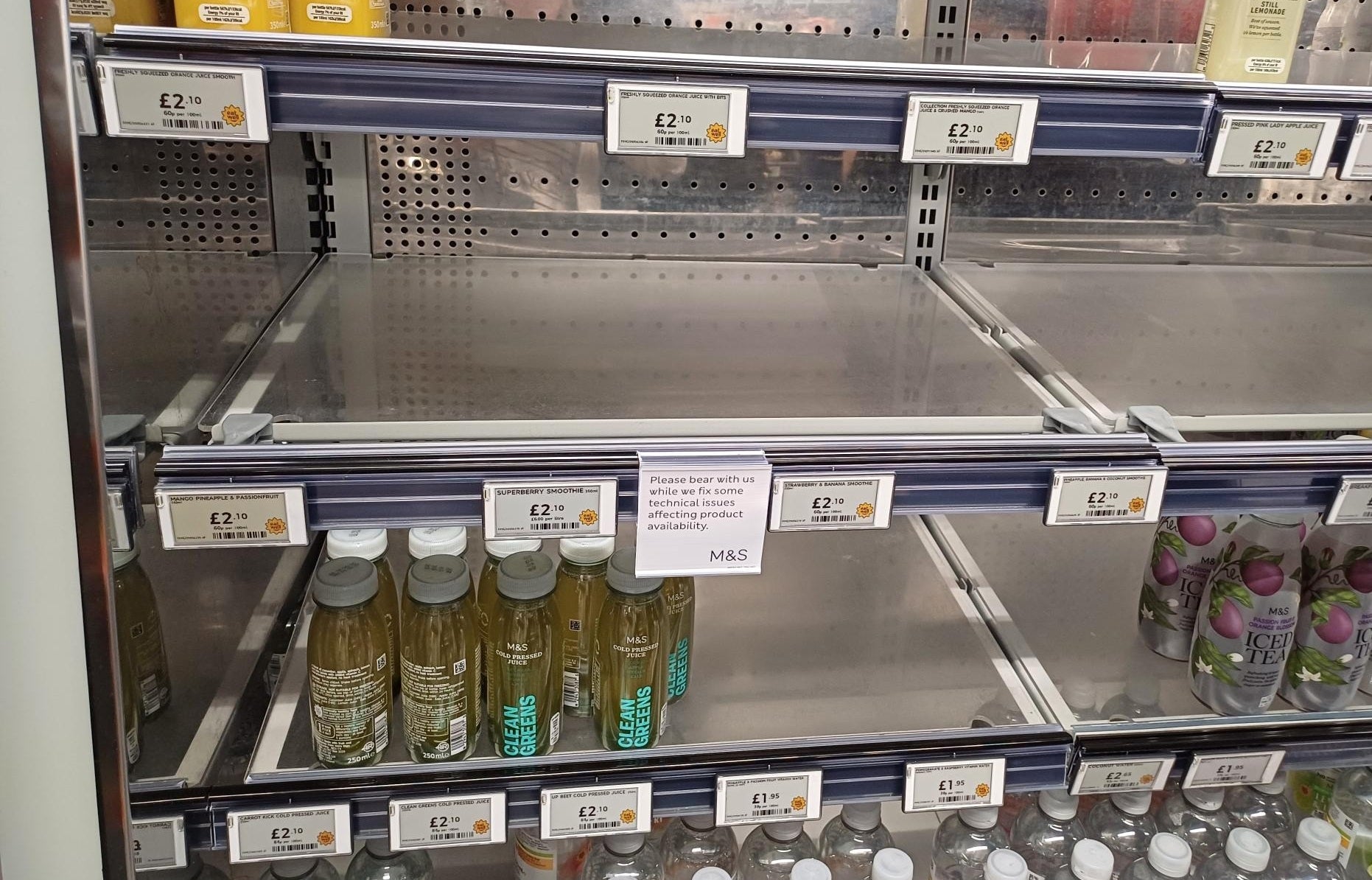A view of empty shelves inside a Marks & Spencer shop last month