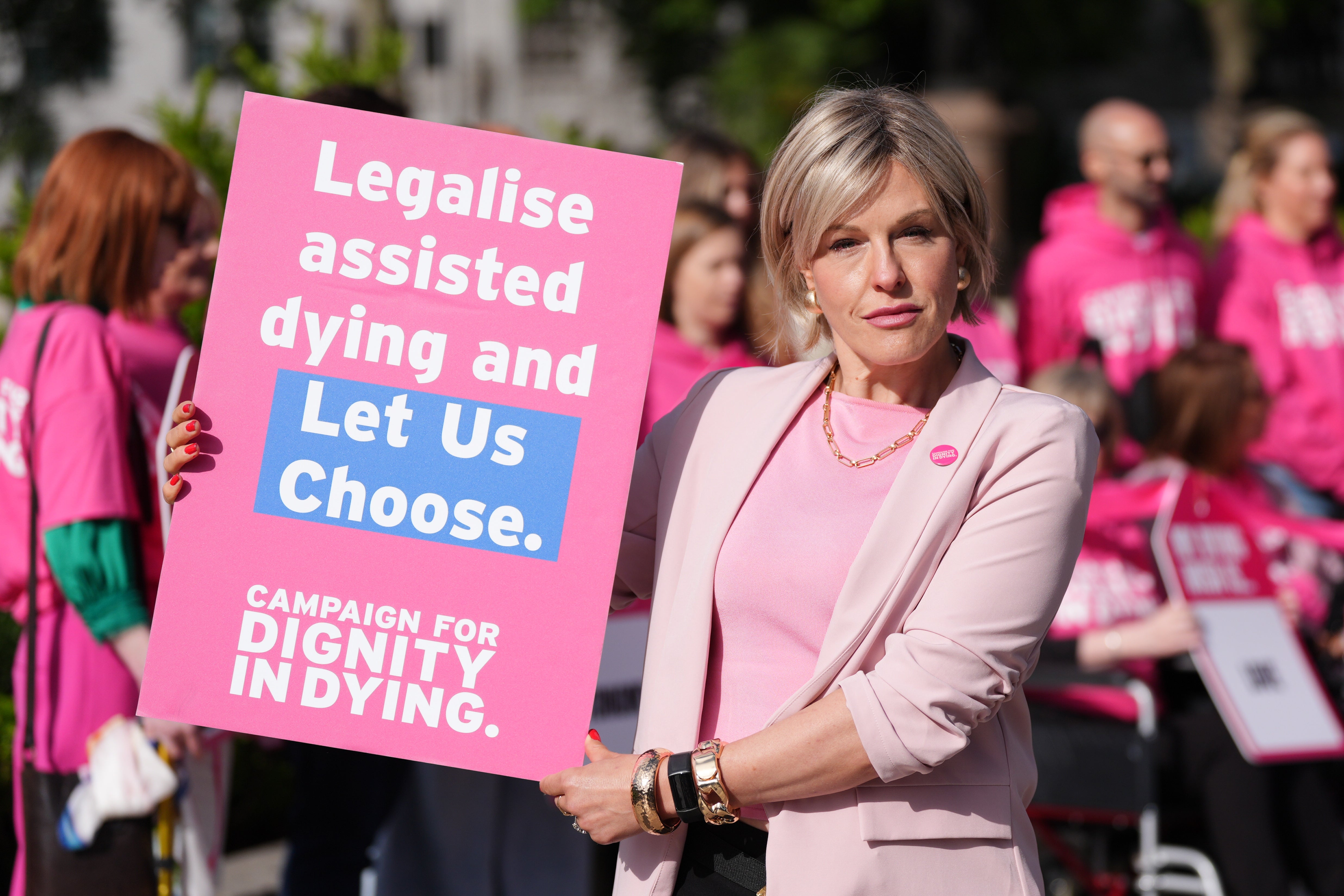 Esther Rantzen's daughter, Rebecca Wilcox, was among those campaigning outside Westminster for assisted dying as other staged a protest against the bill being debated inside