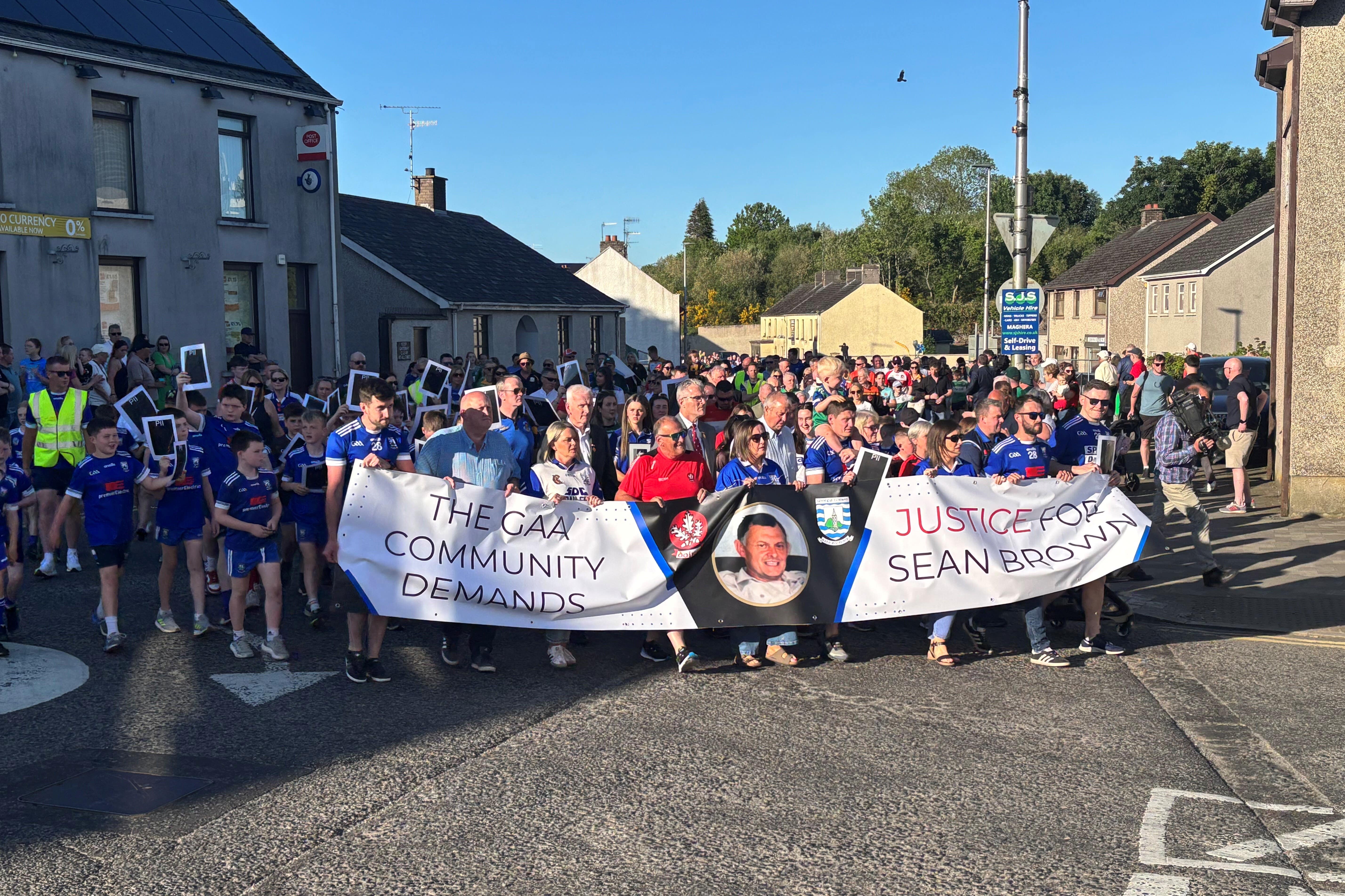 People in the town of Bellaghy, Co Londonderry which came to a standstill on Friday night as they took part in a march in support of the family of Sean Brown (Rebecca Black/PA)