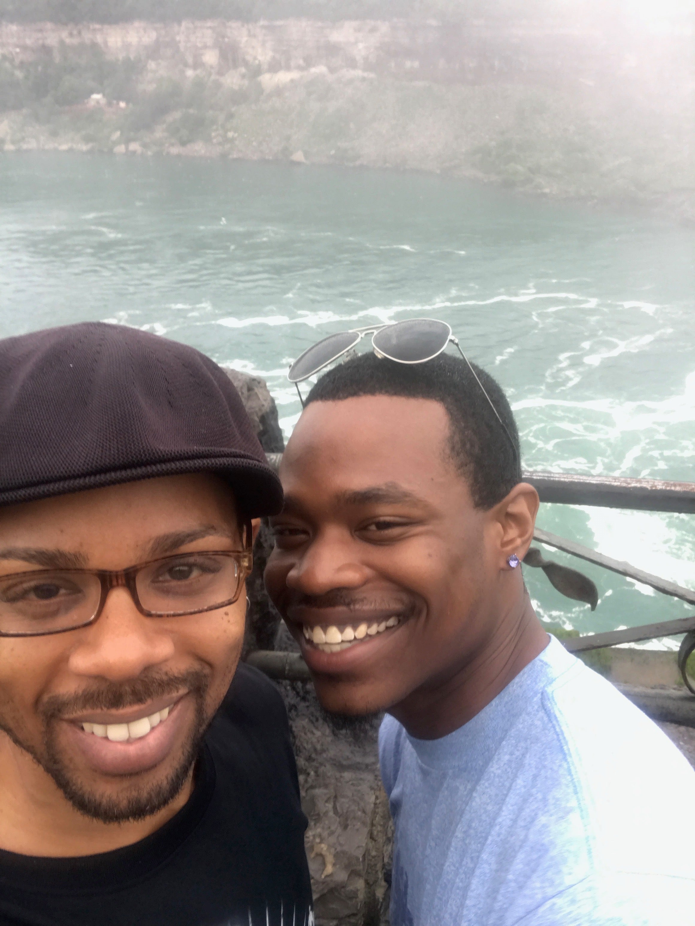 An unidentified Foot Locker security guard is accused of twice inserting his finger into Christian Leitch's belly button before complimenting – and pawing at – Brian Williams's “nice booty,”