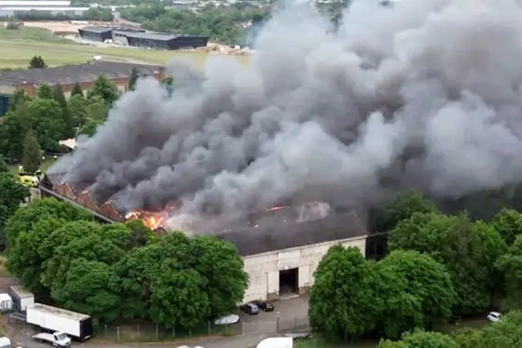 Neighbours heard multiple explosions and clouds of dense black smoke spread for miles