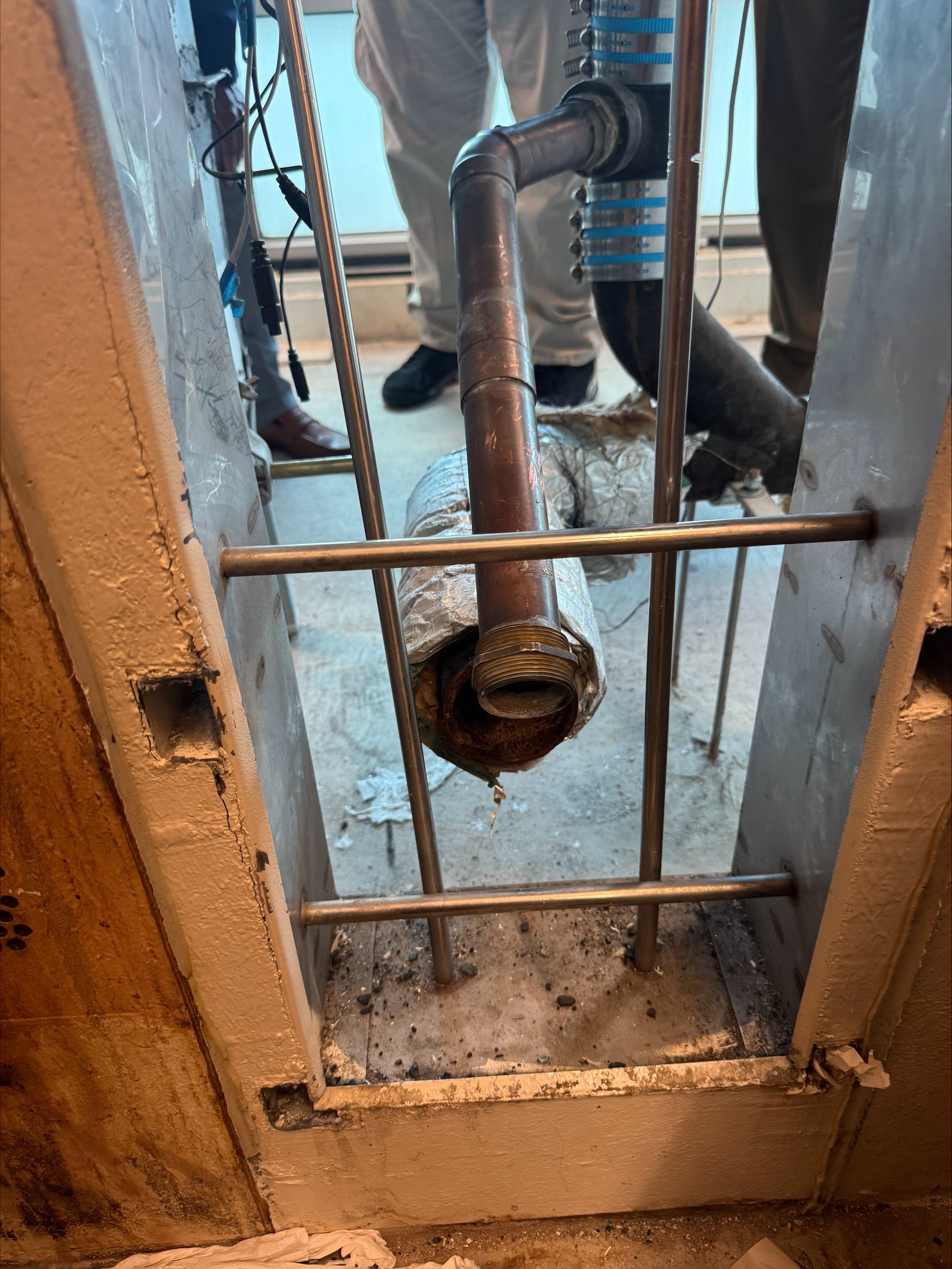 Police say men began escape around 12:23am on Friday and broke through a bathroom wall in a cell.