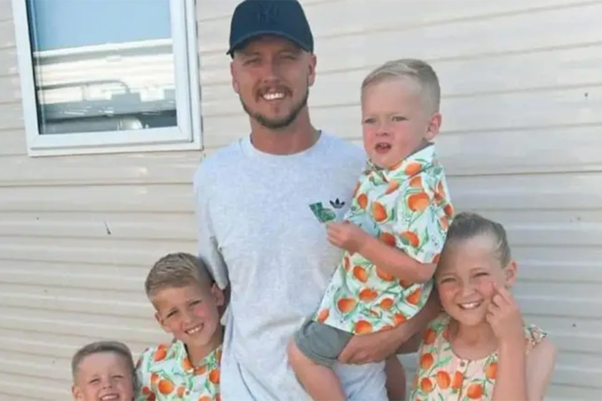 Nathan Osman with his four children