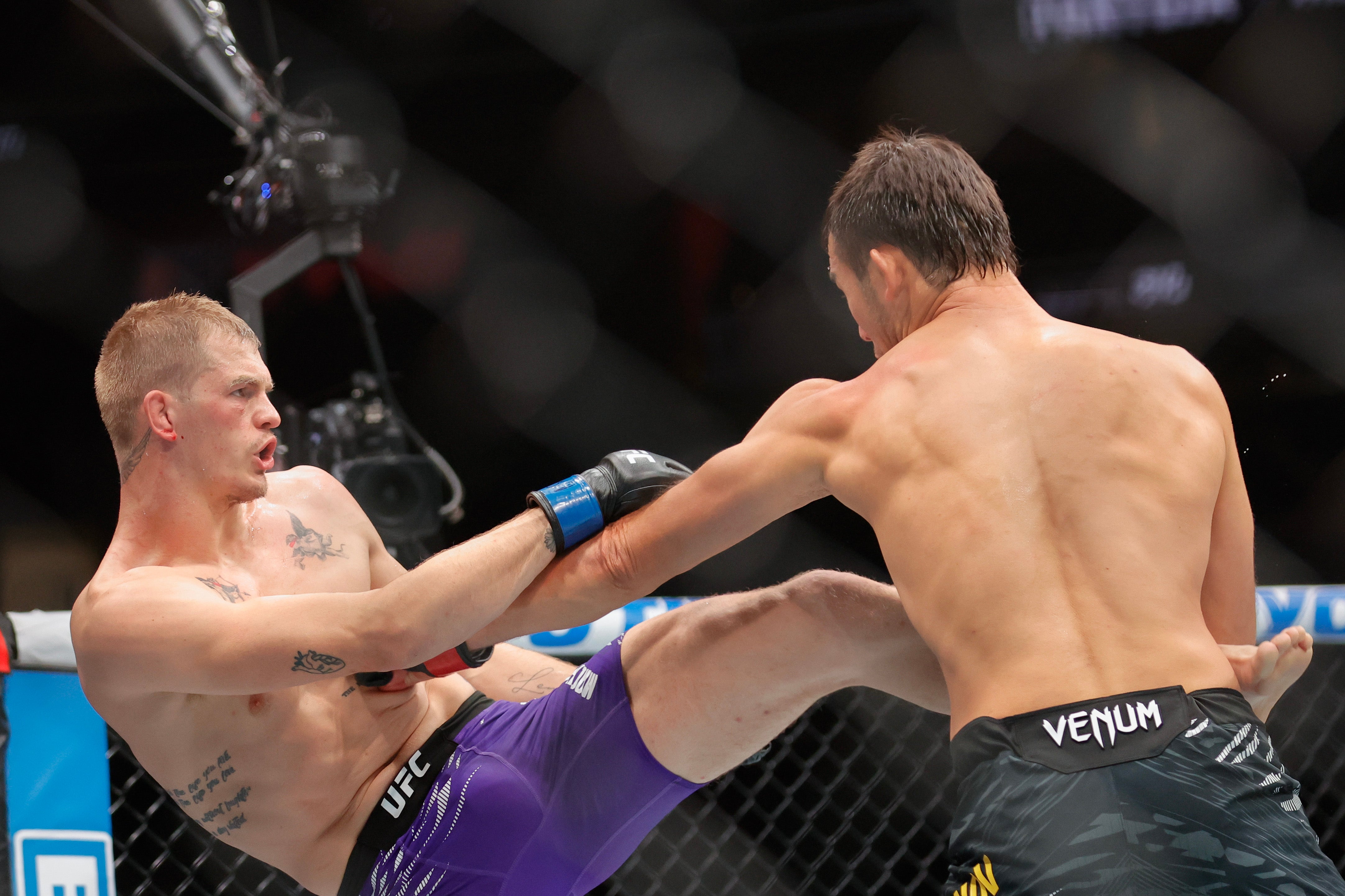 Ian Machado Garry (left) during his narrow loss to Shavkat Rakhmonov