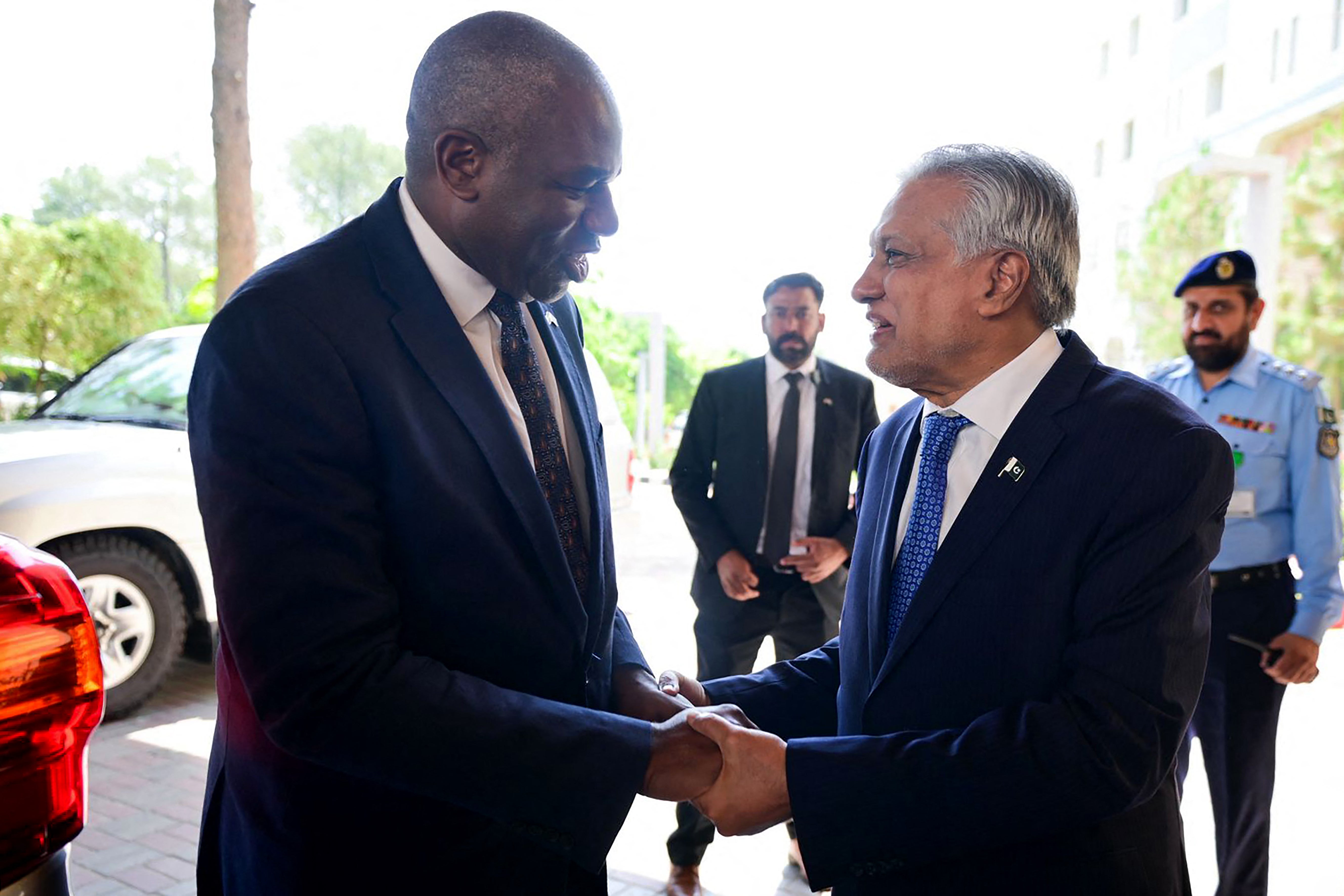 Pakistan's Ministry of Foreign Affairs, Pakistan's Foreign Minister Ishaq Dar (2R) receives Britain's Foreign Secretary David Lammy (L) at the Foreign Ministry in Islamabad