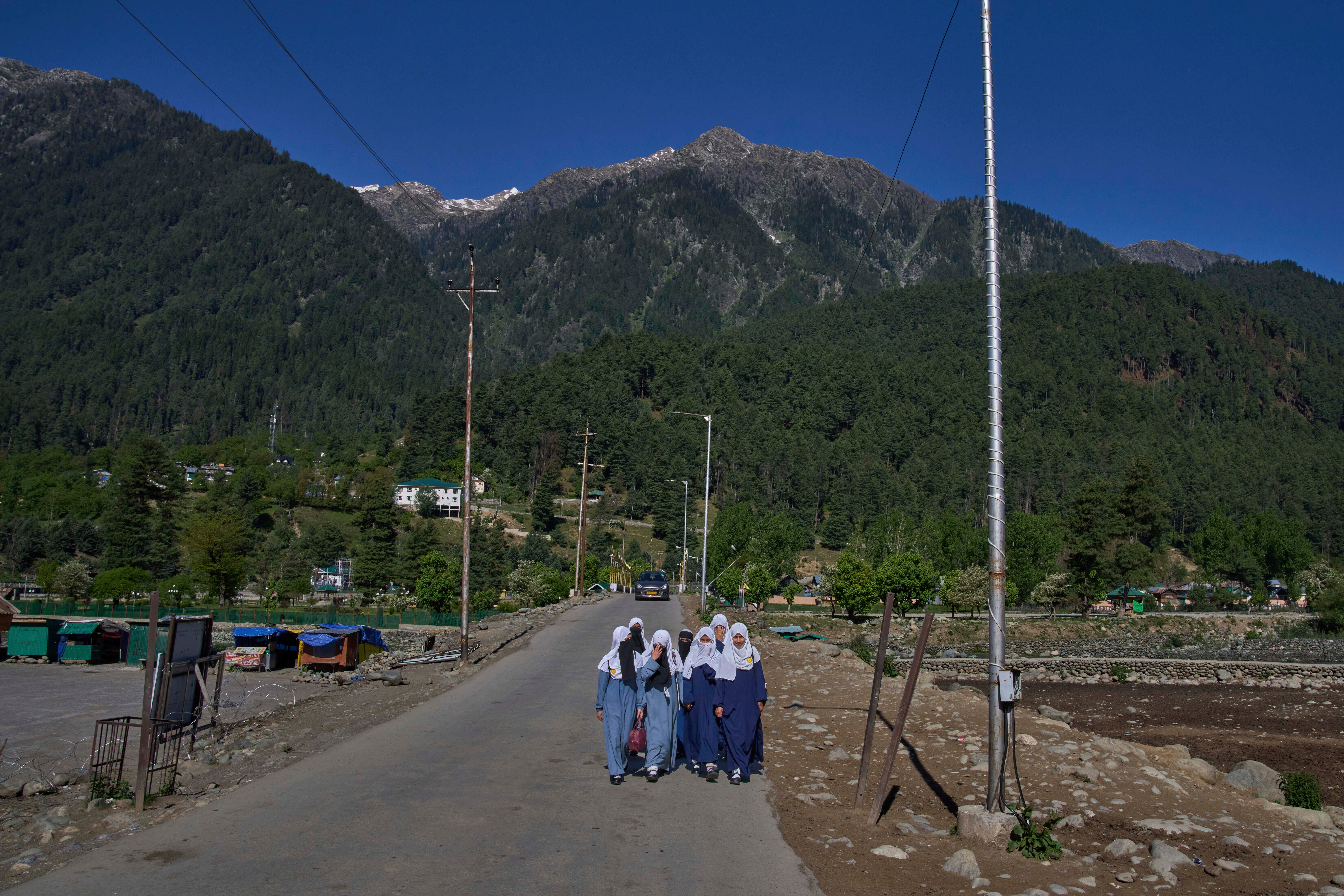 Kashmiri girls walk to school in Pahalgam in Kashmir, Thursday, 16 May 2025
