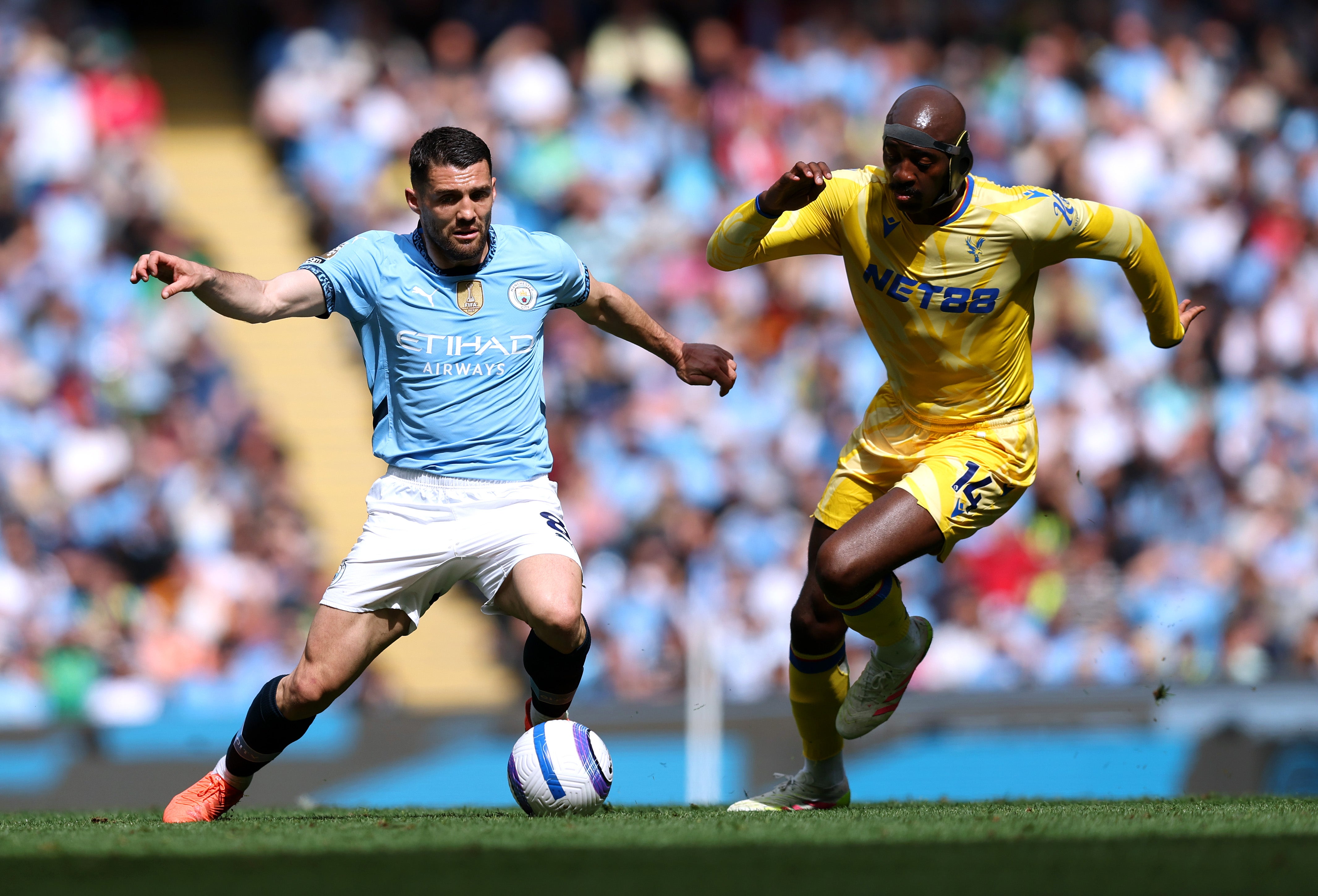 <p>Mateo Kovacic of Manchester City runs with the ball whilst under pressure from Jean-Philippe Mateta of Crystal Palace </p>