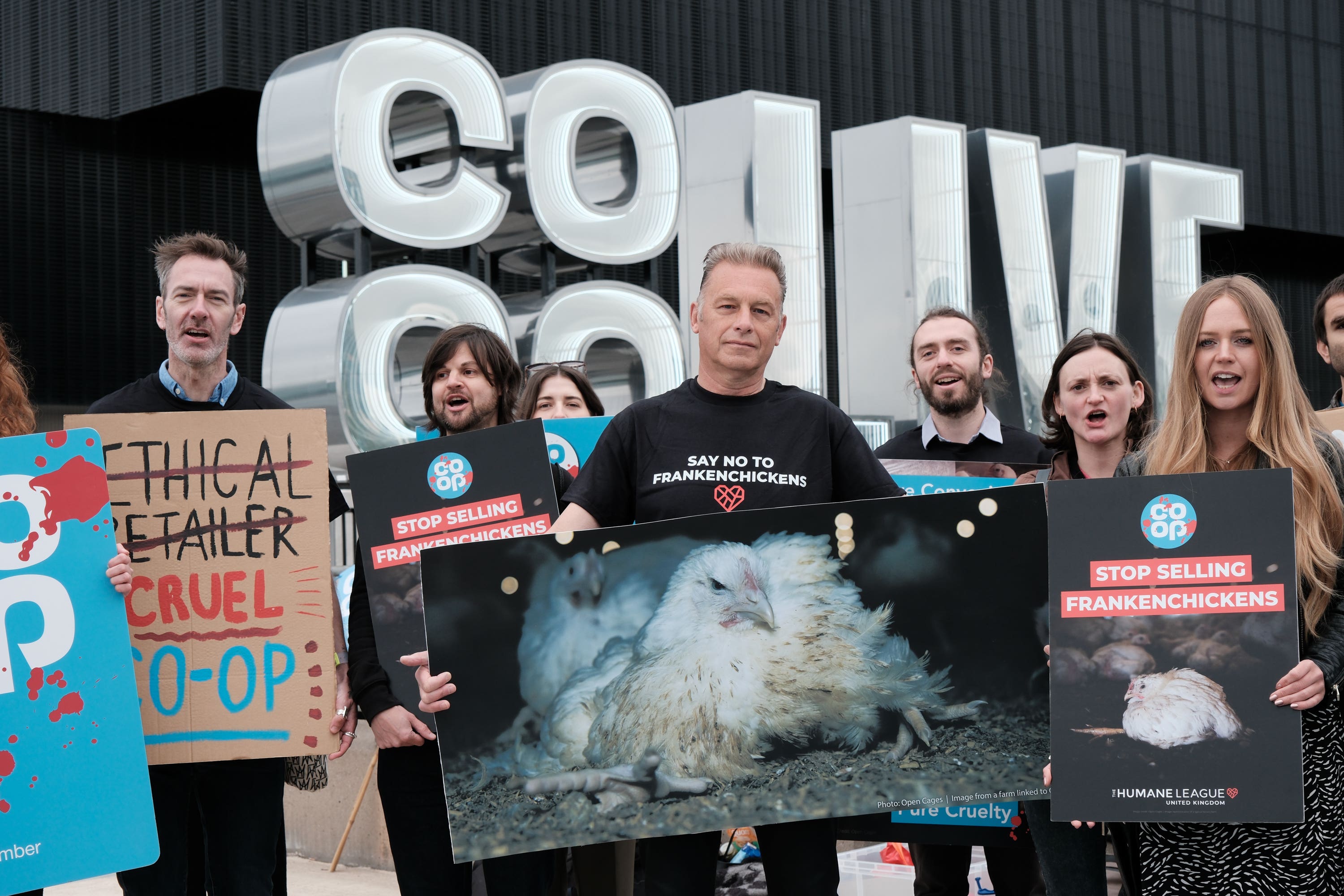 Chris Packham (centre) joined demonstrators outside the Co-Op AGM in Manchester (Sammi Davis/The Humane League/PA)
