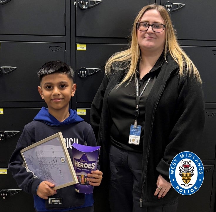 Ayaan Juman with call handler Rebecca Kelly after receiving an award for helping his mother get emergency care