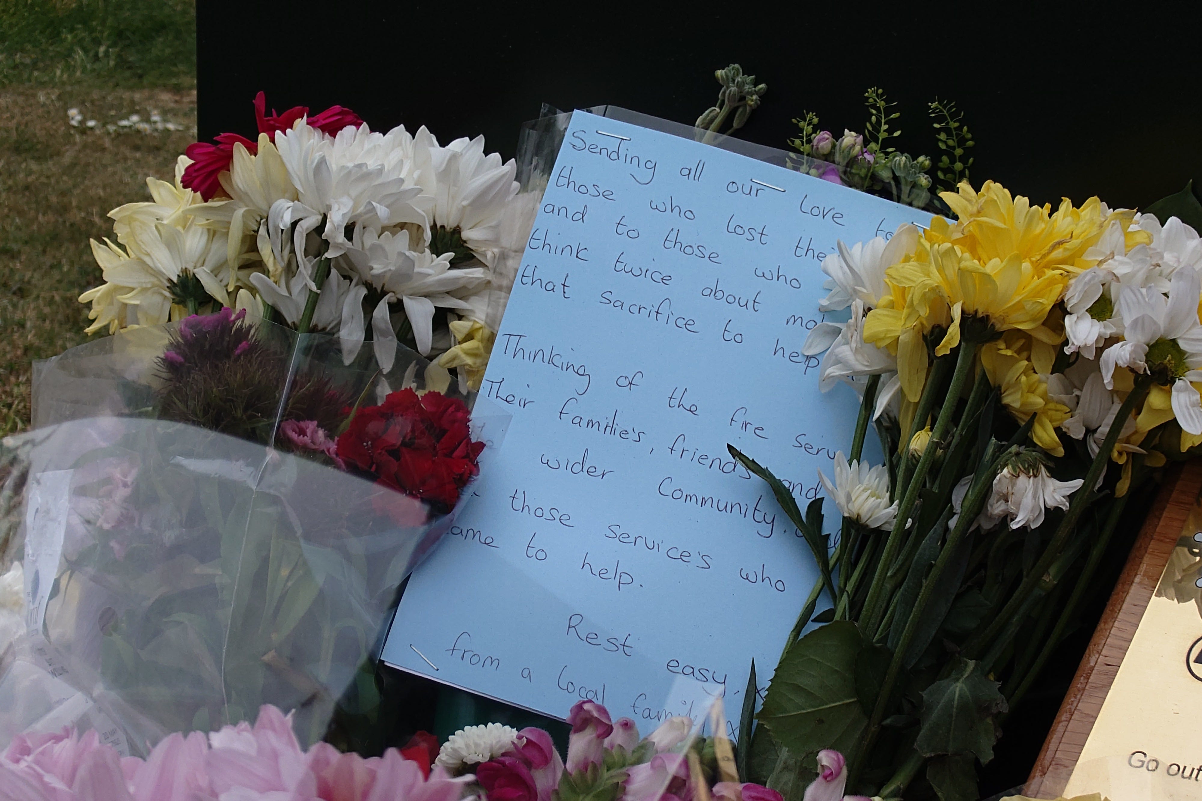 Floral tributes left near the scene of the fire at Bicester Motion (Jamie Lashmar/PA)