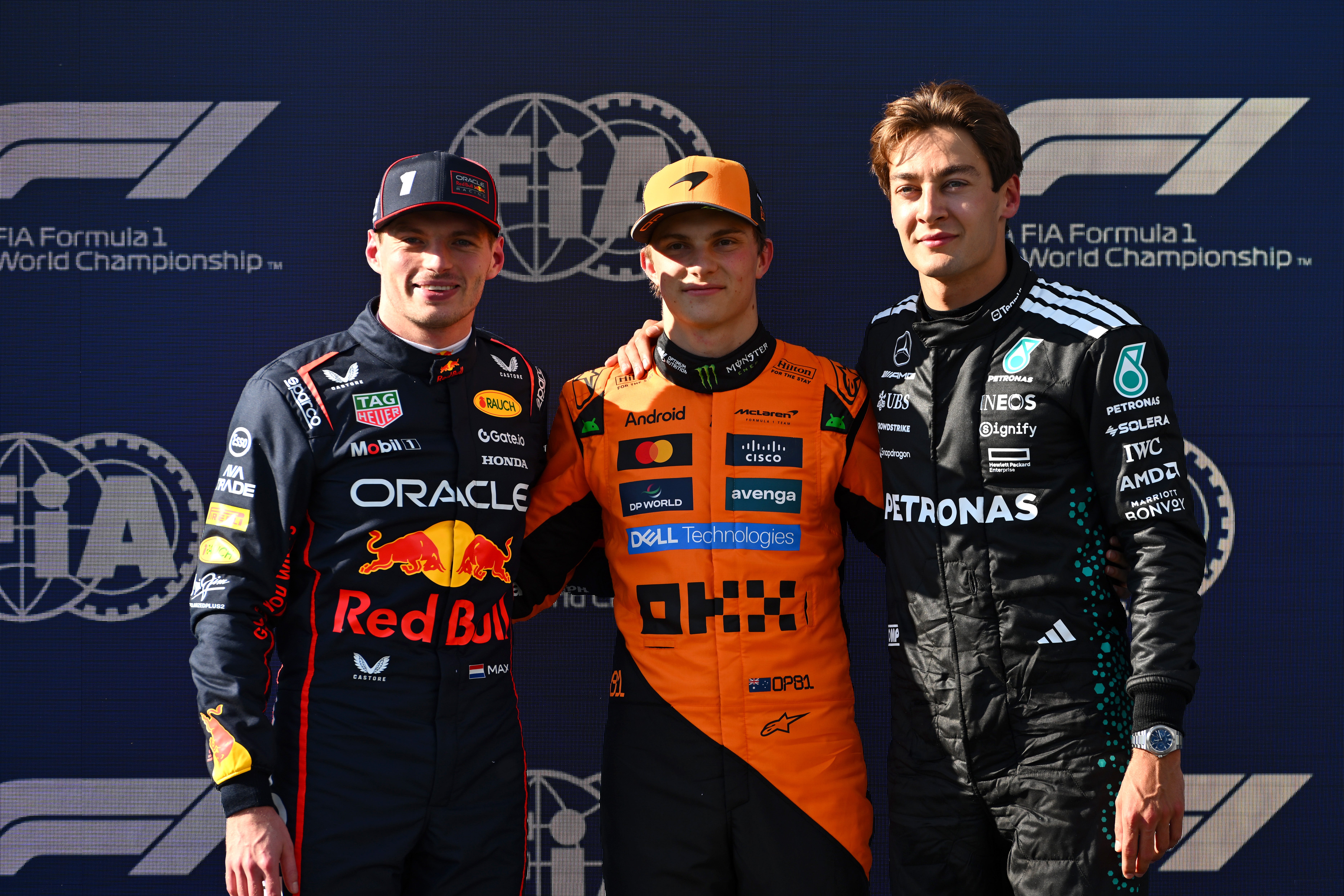Oscar Piastri, centre, takes pole position, with Max Verstappen, left, second, and George Russell third