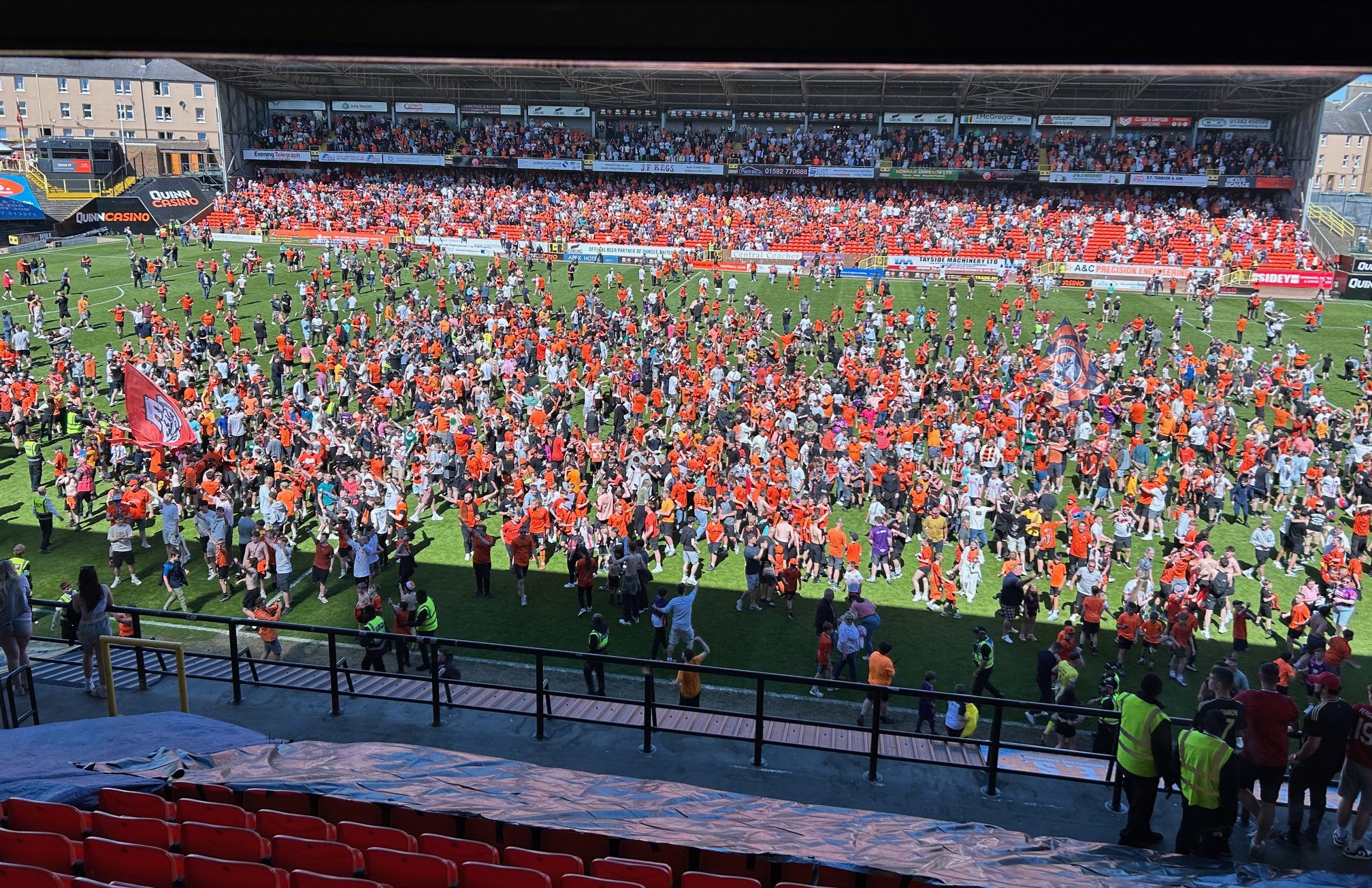 Fans invaded the pitch after the game at Tannadice