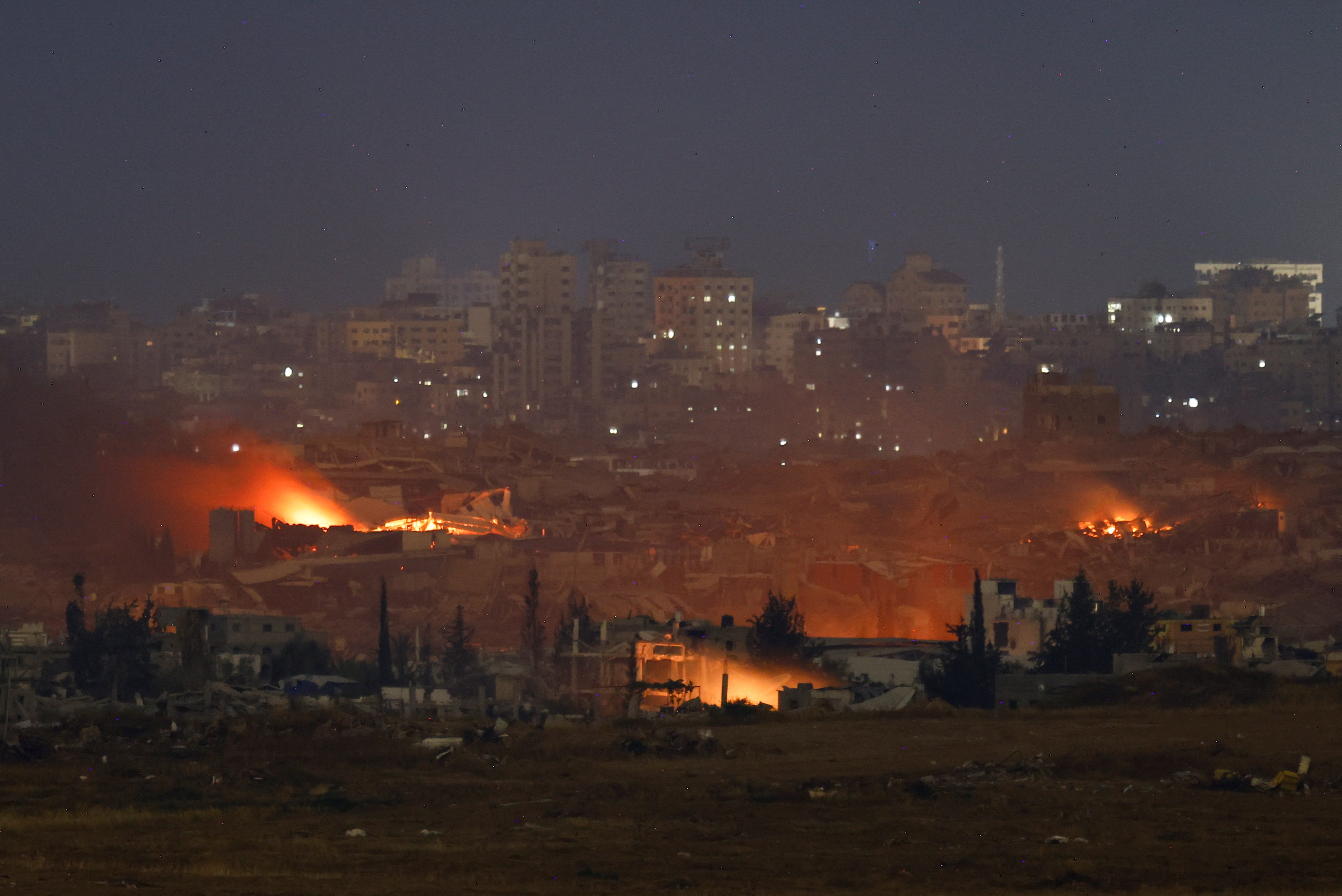 Flames rise from northern Gaza, as seen from the Israeli side of the border on Saturday