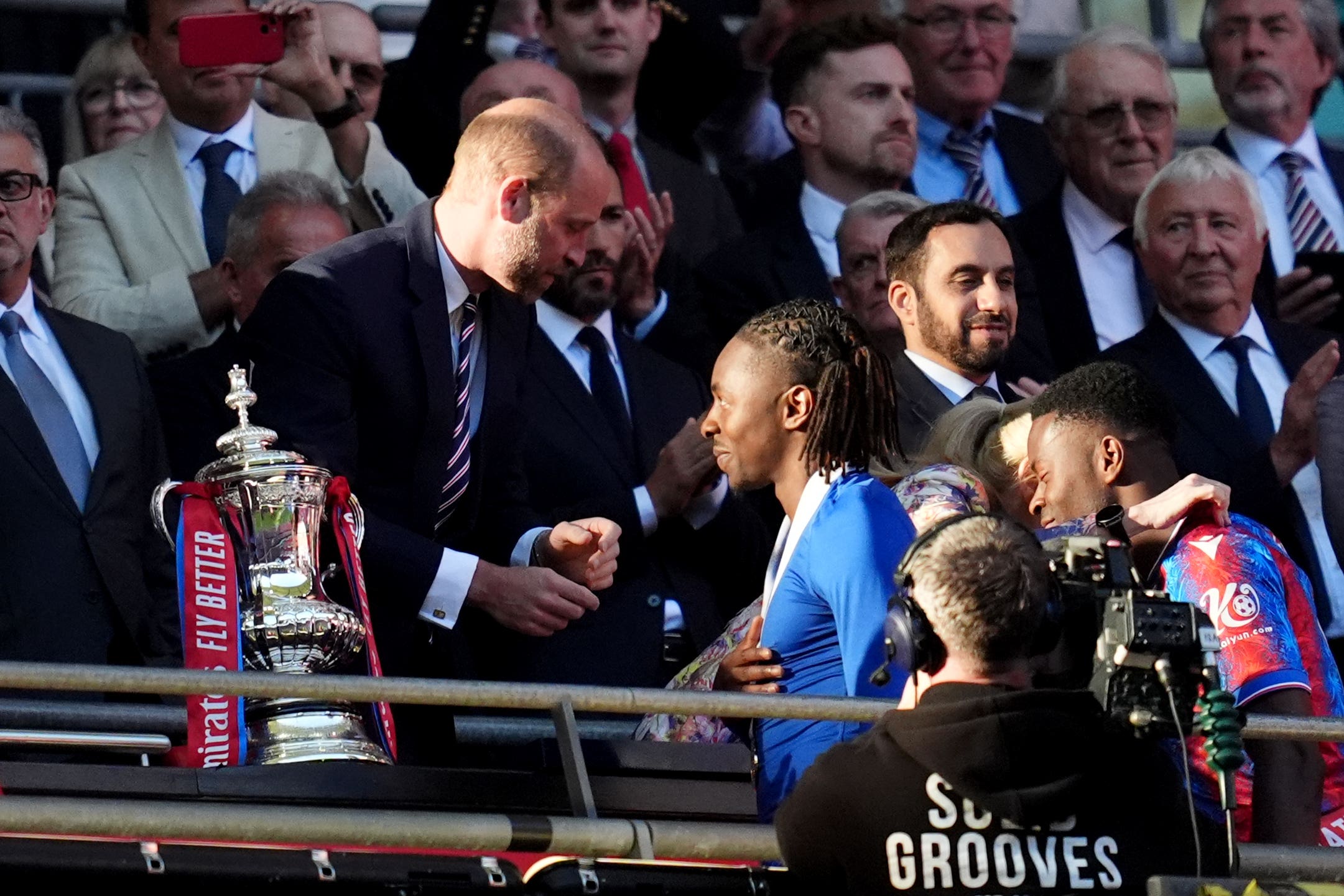 The Prince of Wales presents Crystal Palace’s Eberechi Eze with his winners medal (Adam Davy/PA)