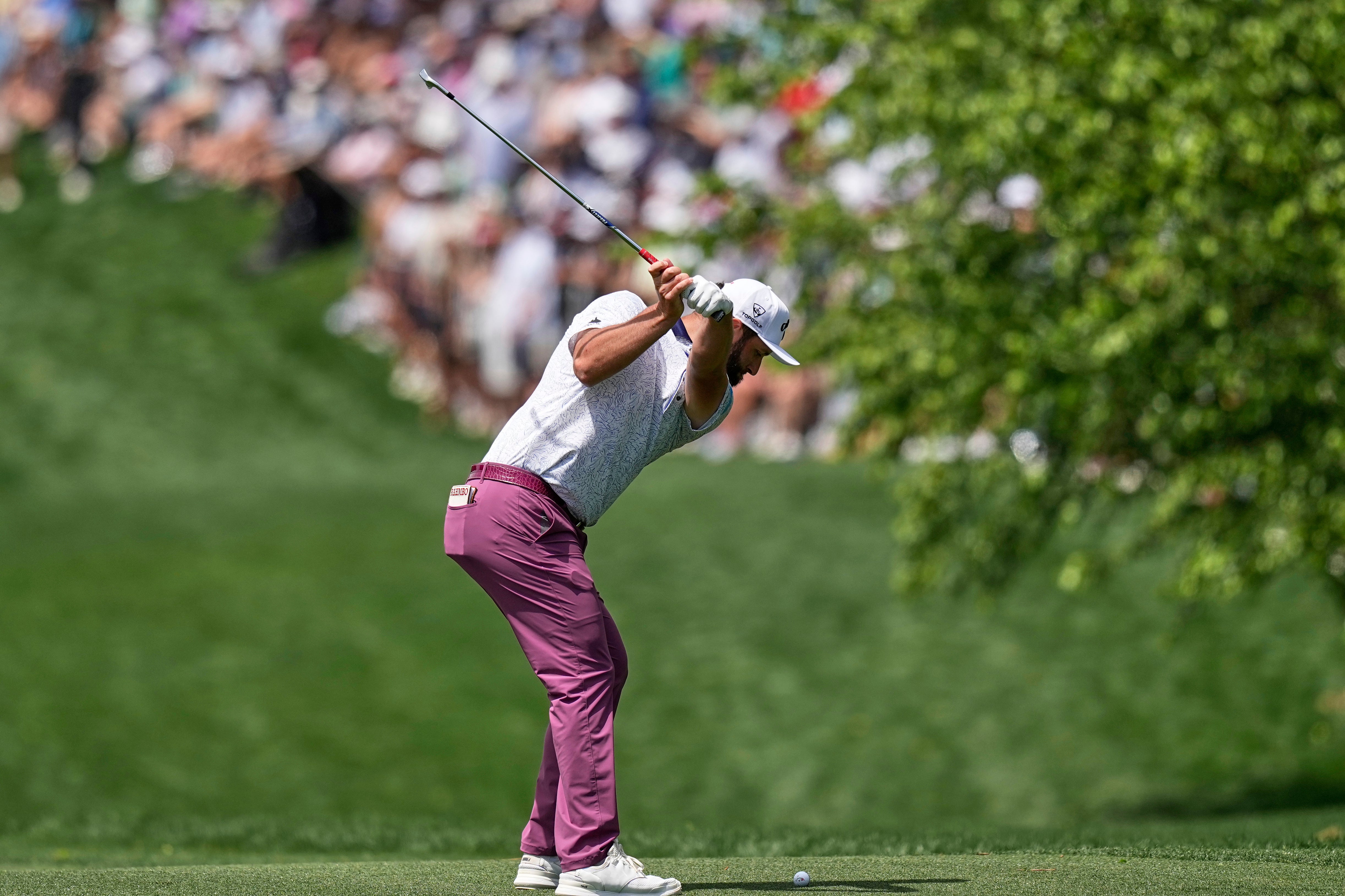 Jon Rahm hits from the fairway on the first hole during the third round of the PGA Championship (David J Phillip/AP)