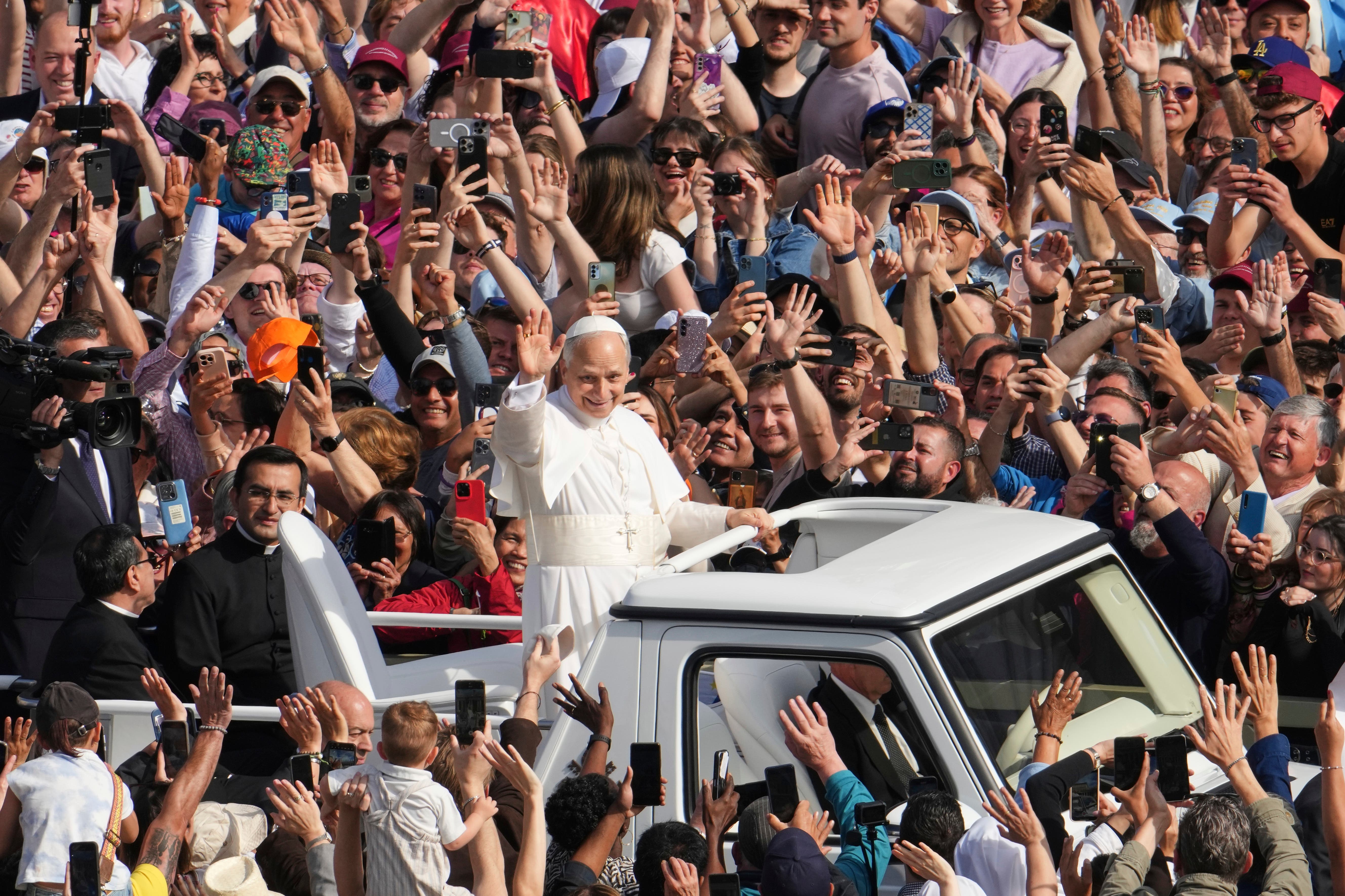 Pope Leo XIV greeted jubilant crowds from the popemobile ahead of the ceremony (Domenico Stinellis/AP)