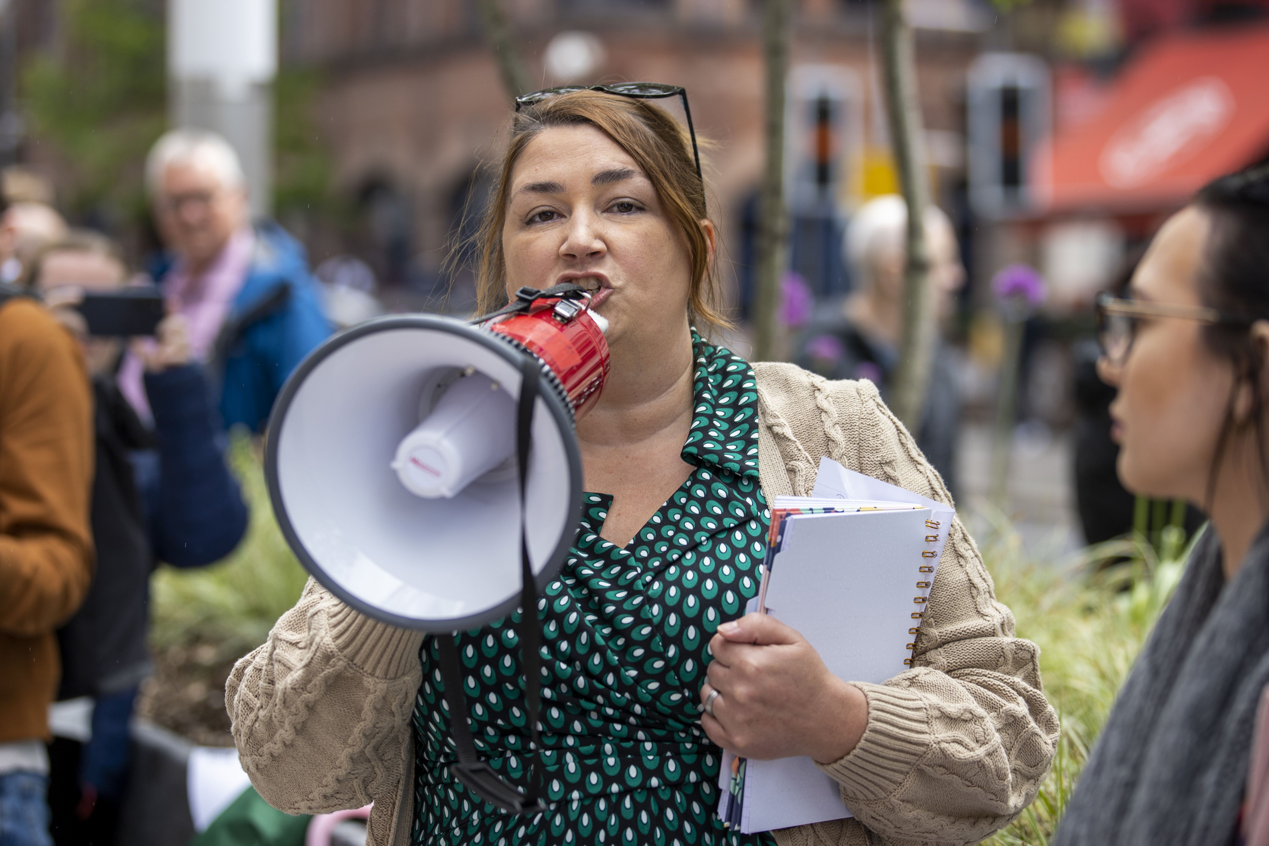 Andree Murphy addresses a crowd outside the Northern Ireland Office UK Government Hub (PA)