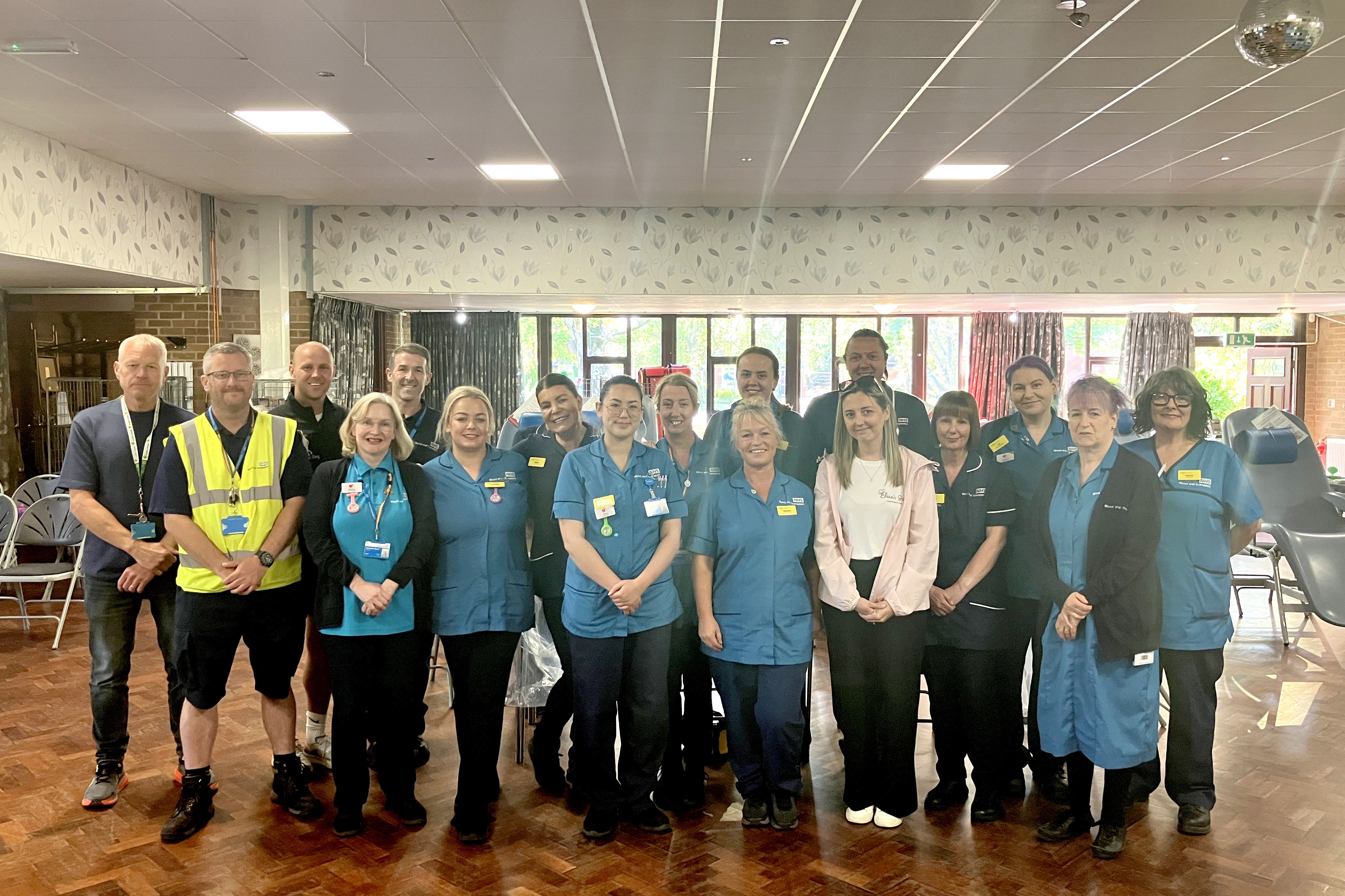 Handout photo issued by NHS Blood and Transplant of Jenni Stancombe (front row, white tshirt) and Dave Stancombe (third left), the parents of Elsie Dot Stancombe, at a blood donation session in Southport (NHS Blood and Transplant/PA)