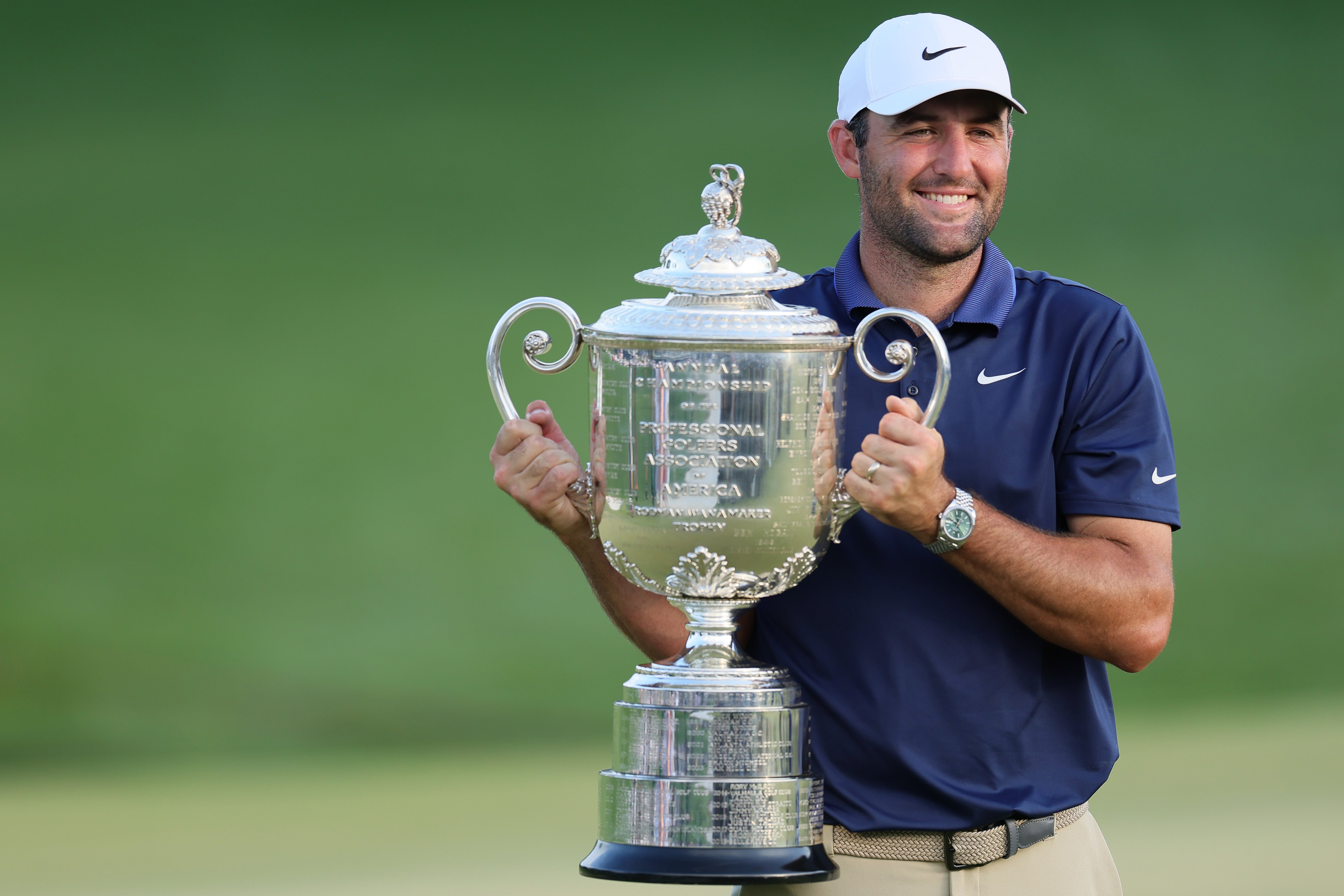Scottie Scheffler poses with the Wanamaker Trophy
