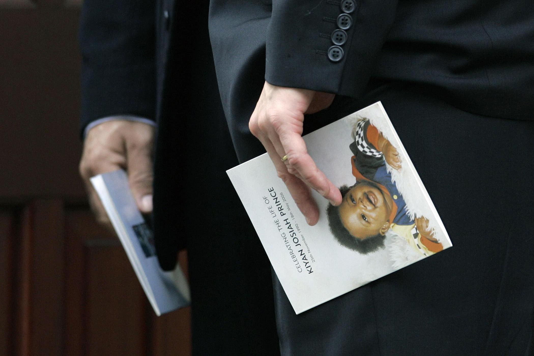 Mourners hold the order of service at the funeral for murdered young QPR footballer Kiyan Prince (Edmond Terakopian/PA)