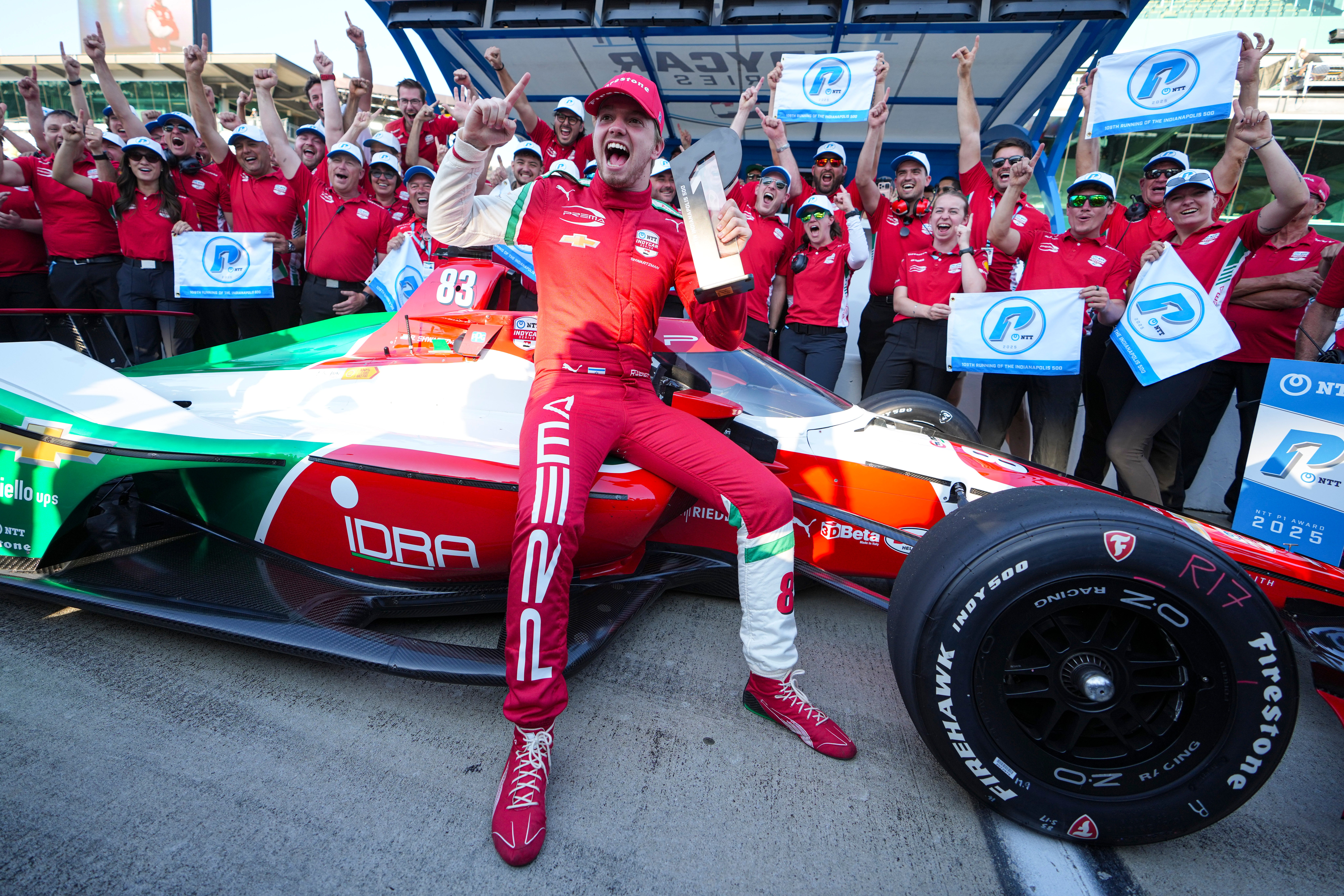 Robert Shwartzman, of Israel, celebrates after winning the pole position during qualifications for the Indianapolis 500 auto race at Indianapolis Motor Speedway in Indianapolis, Sunday, May 18, 2025