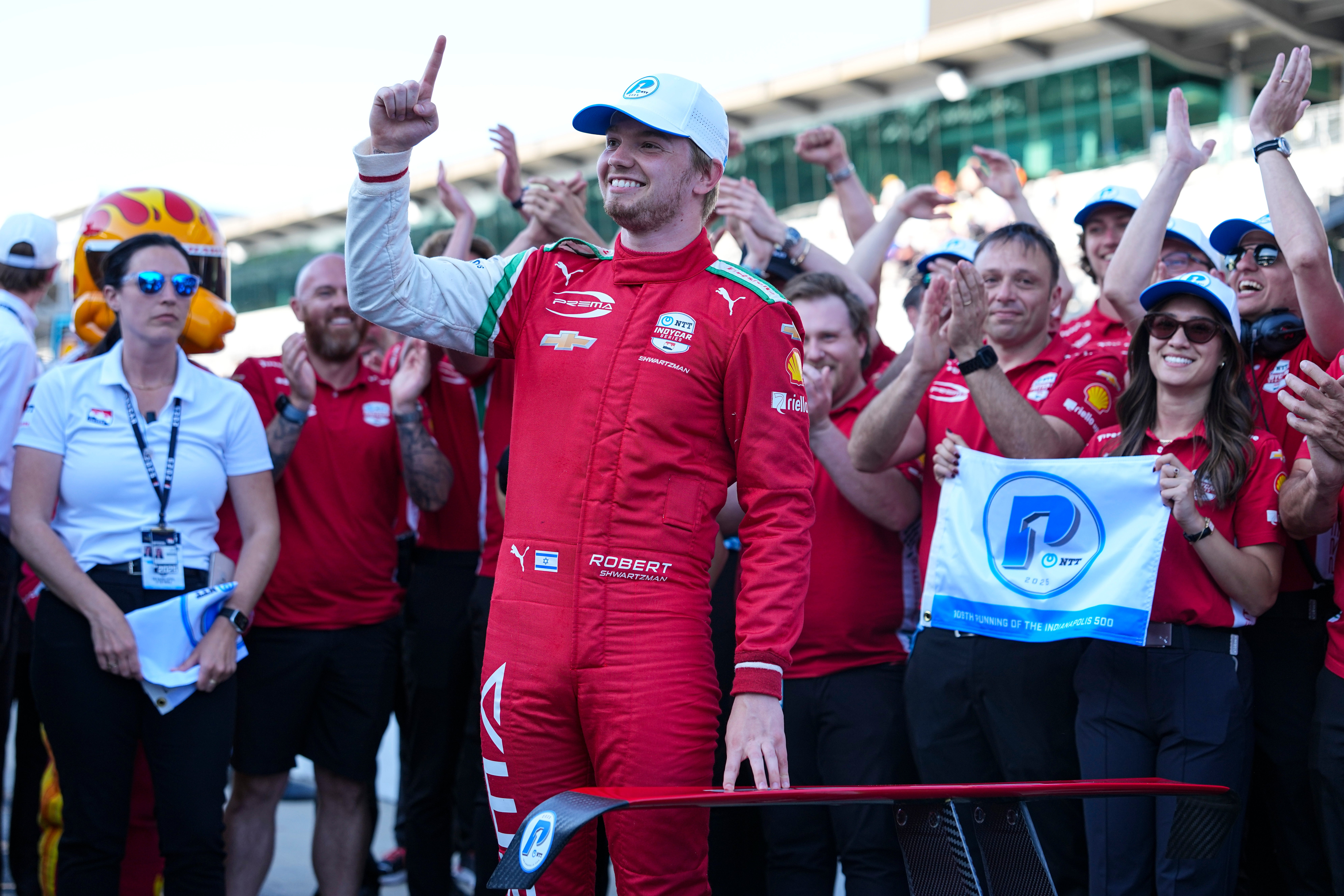 Robert Shwartzman, of Israel, celebrates after winning the pole position during qualifications for the Indianapolis 500 auto race at Indianapolis Motor Speedway in Indianapolis, Sunday, May 18, 2025