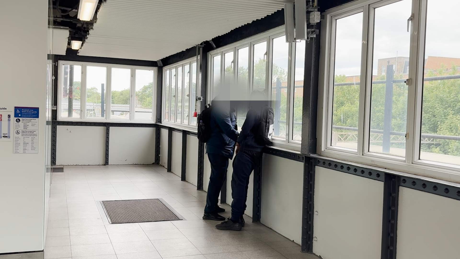A man is stopped for fare evading at Ilford station