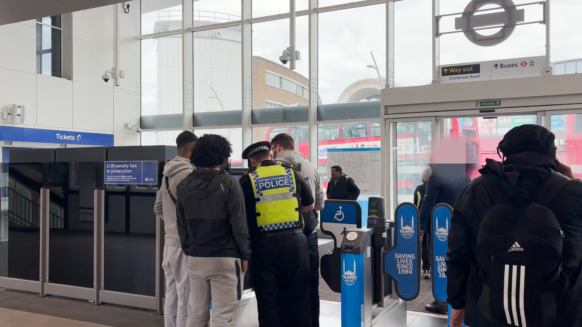 BTP officers questioning passengers during their operation to stop fare dodgers in Ilford
