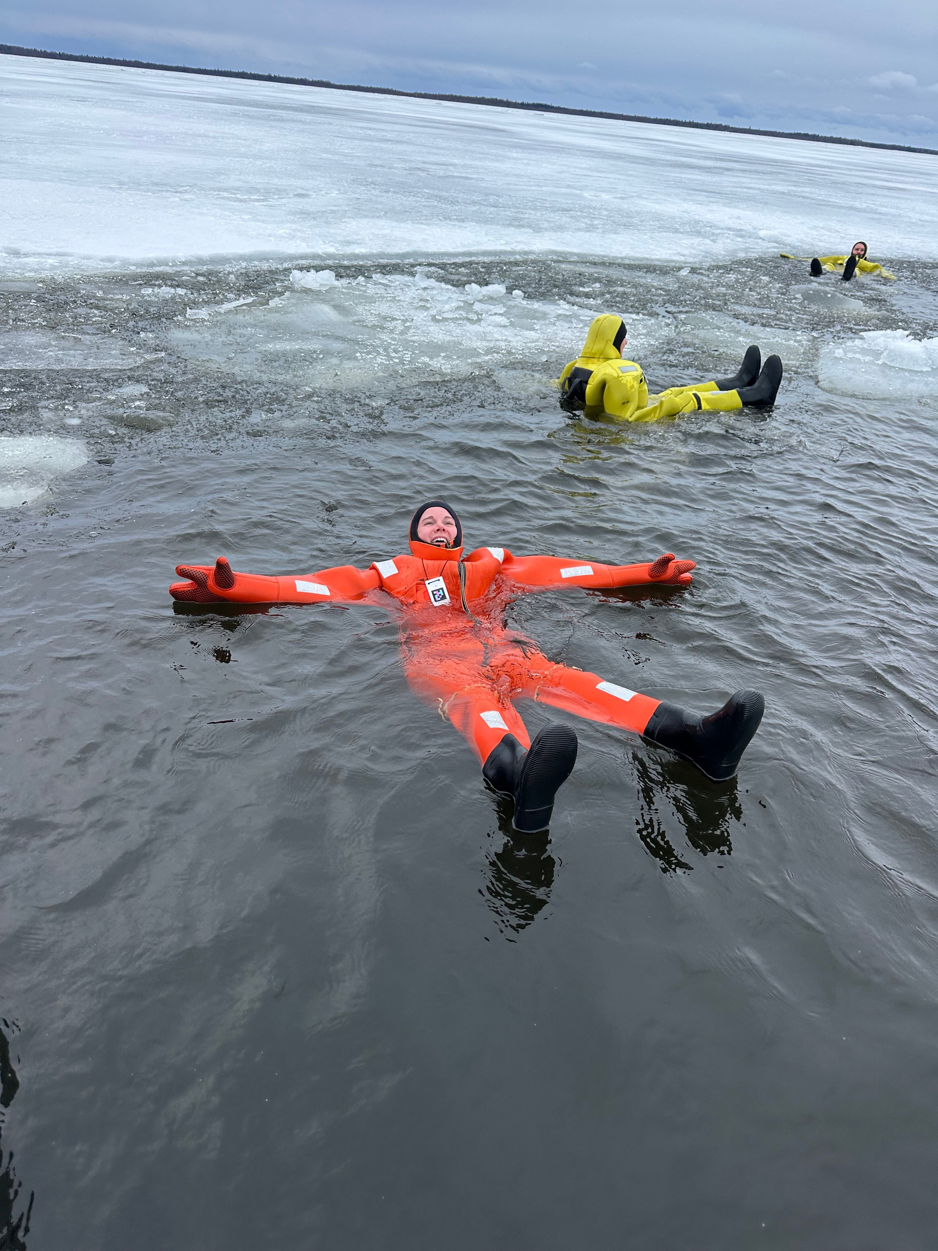 Writer Harriet Mallinson floats in icy waters in the Arctic