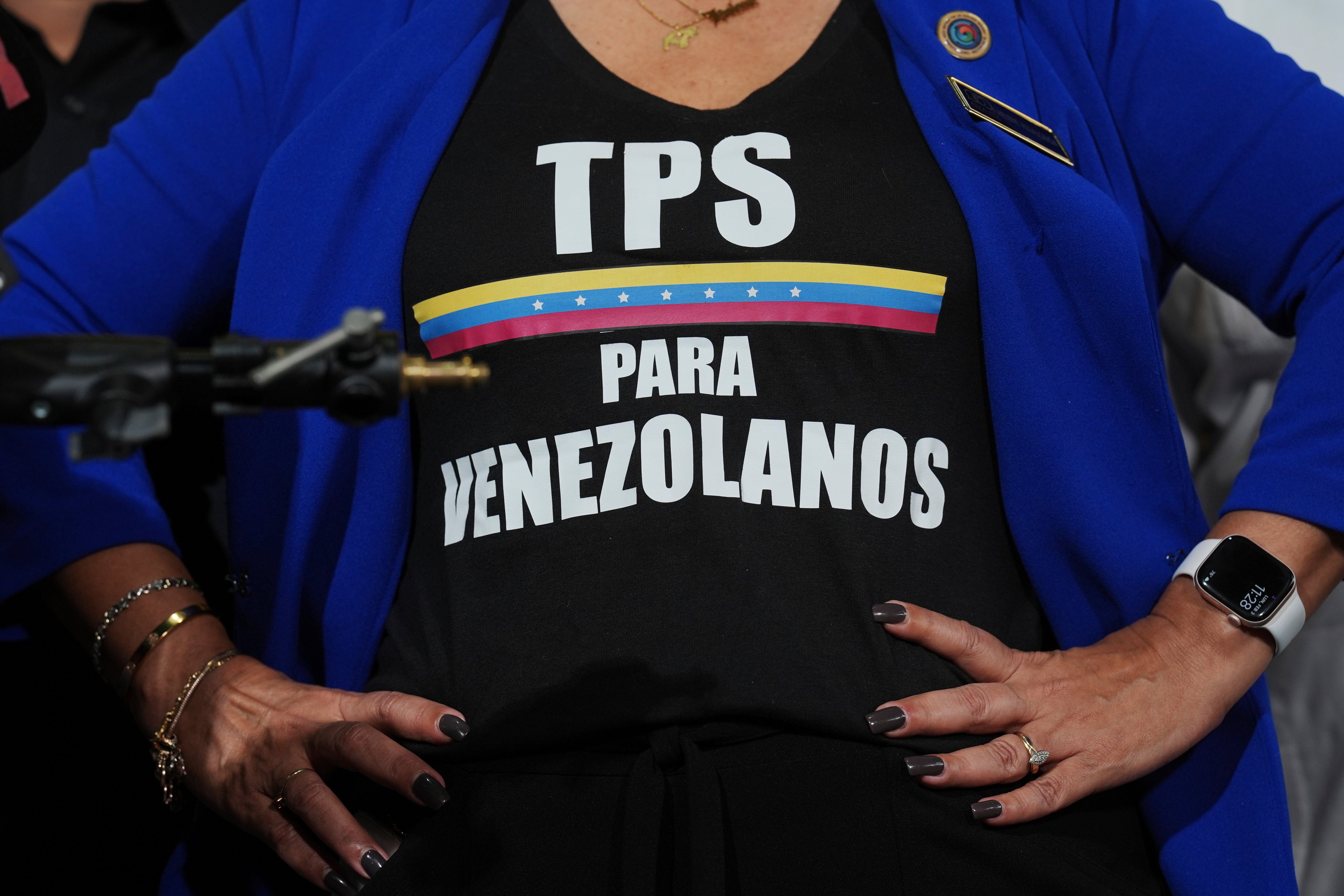 Activist Helene Villalonga wears a T-shirt calling for temporary protected status for Venezuelans