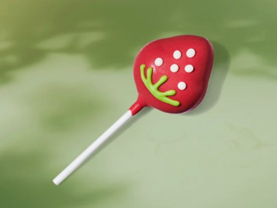 Starbucks has unveiled a new cake pop flavor and design that resembles a strawberry.