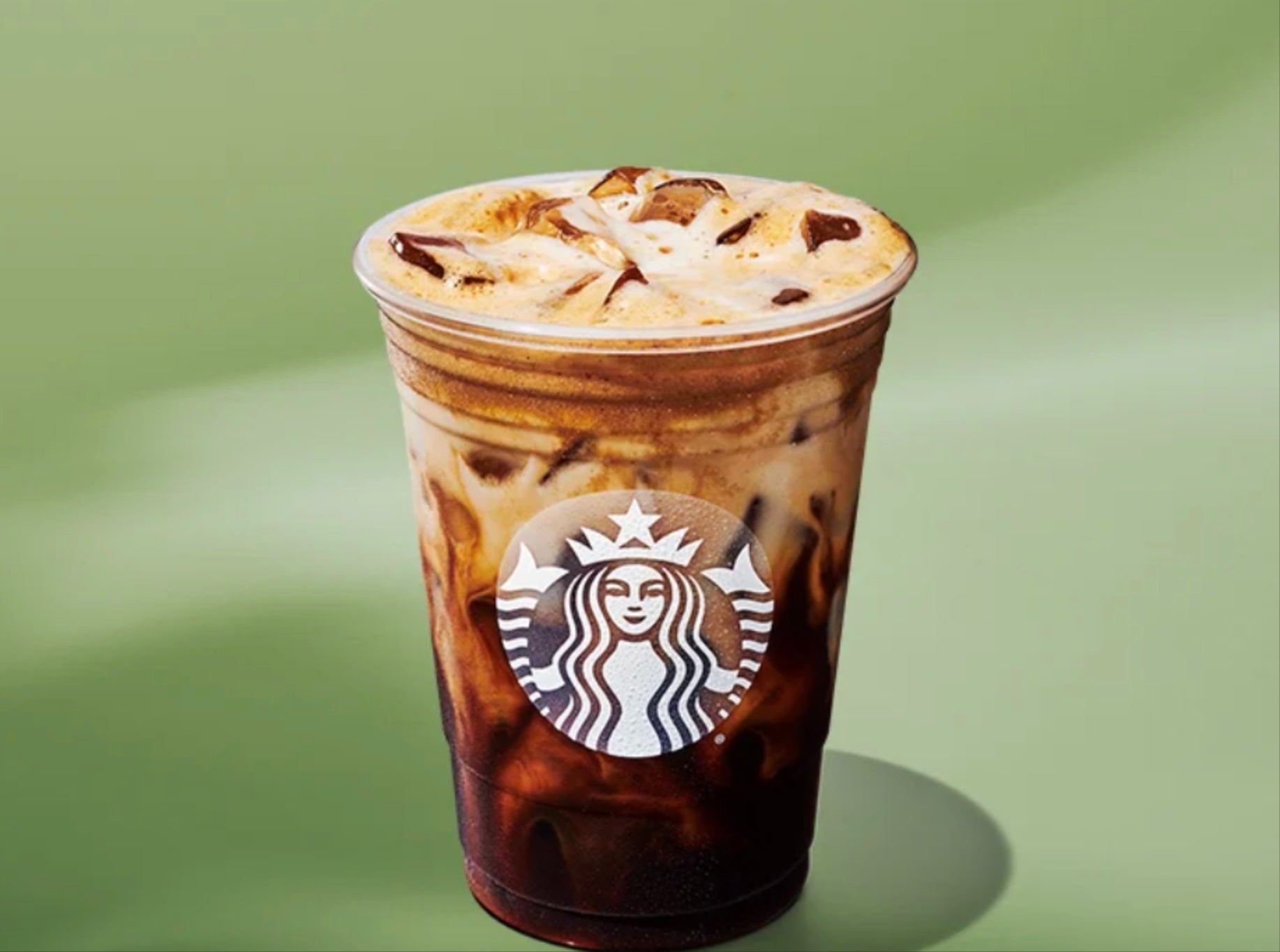 Starbucks has revealed its new summer menu that features new food and drink options. Pictured is the new Iced Horchata Oat Milk Shaken Espresso.