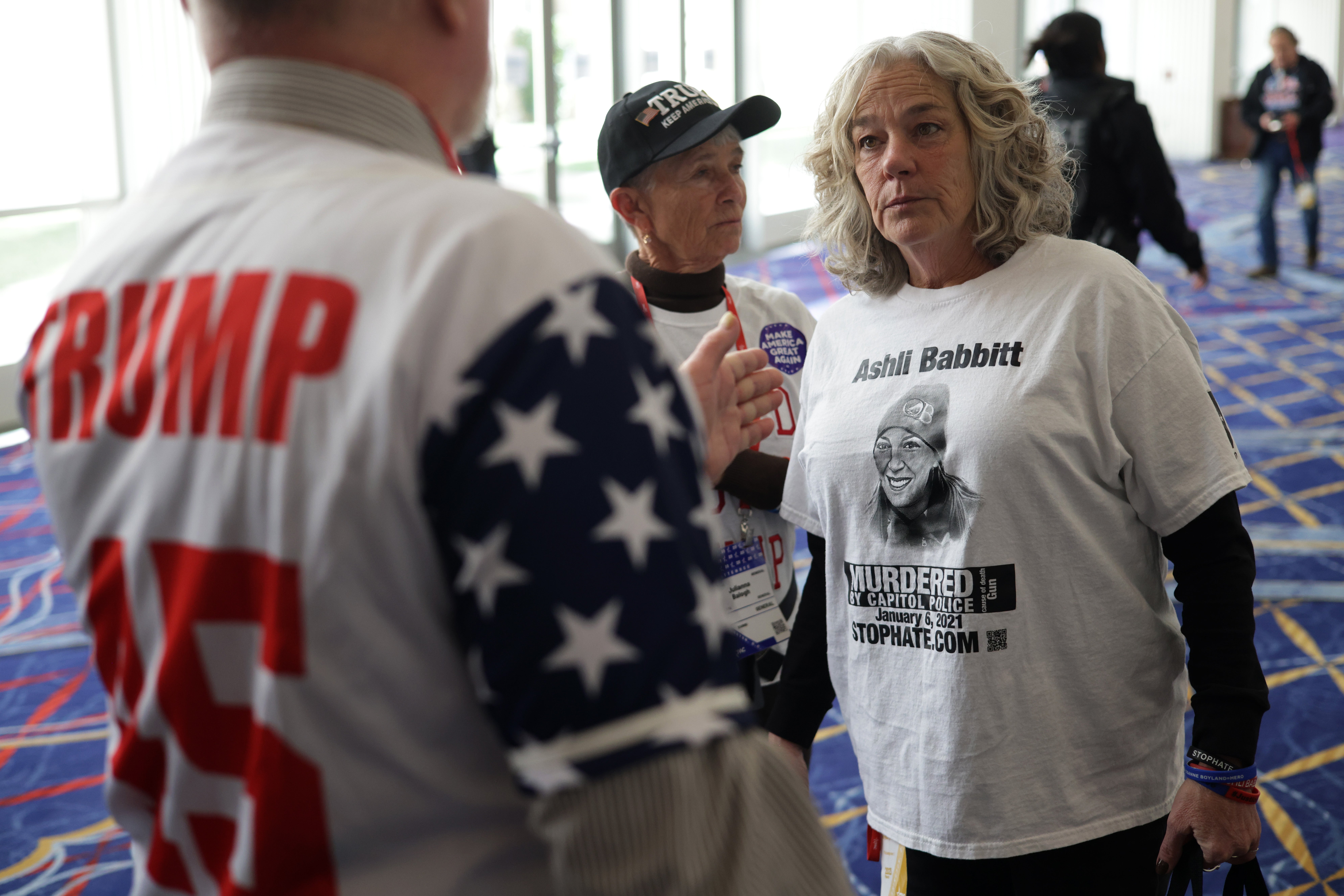 Micki Witthoeft, mother of Ashli Babbitt, talks to a Trump supporter at CPAC. The Trump administration is expected to pay out $5 million to the Capitol rioter’s family to settle a wrongful death lawsuit.