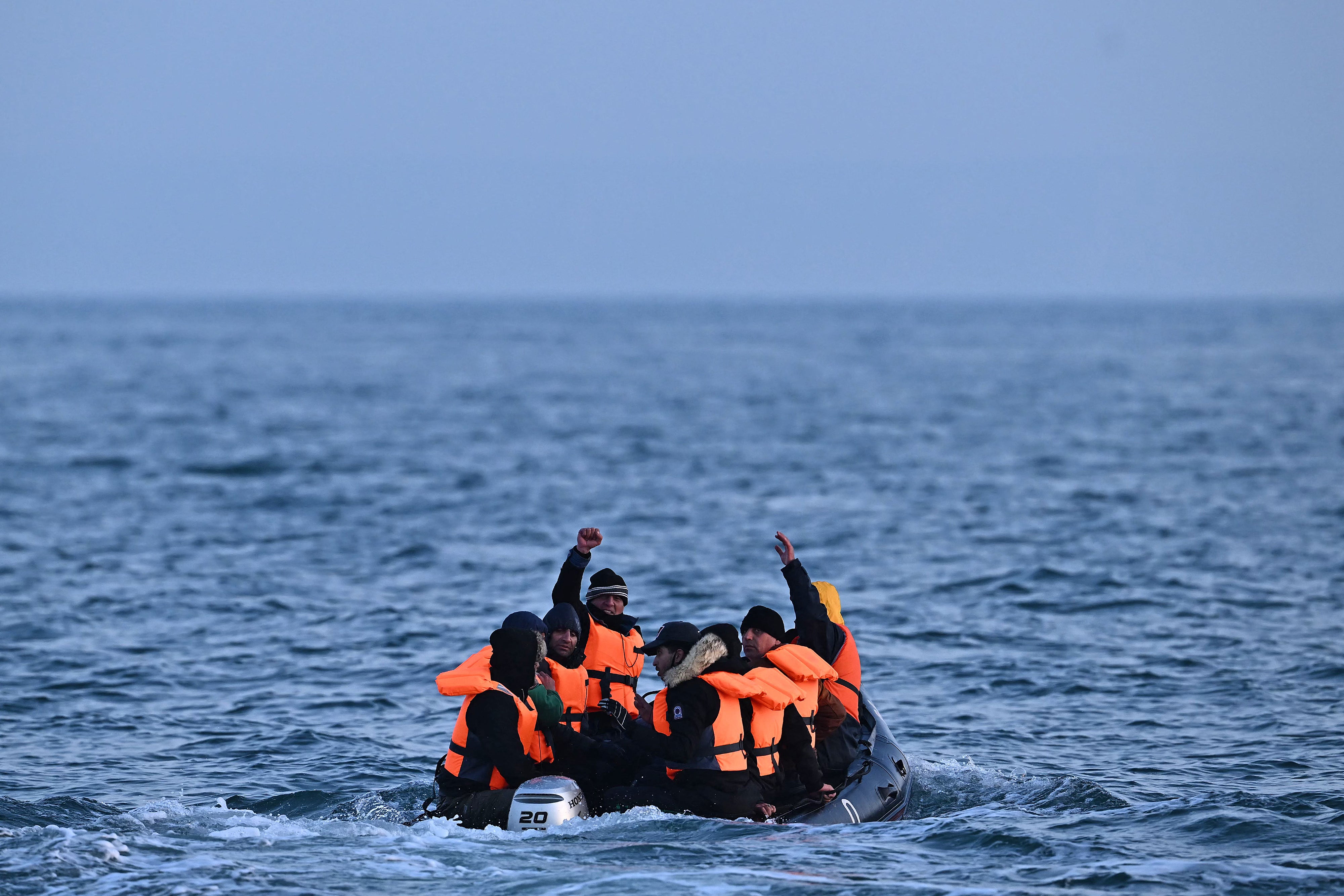 Migrants travel in an inflatable boat across the English Channel, bound for Dover on the south coast of England on 5 April 2023
